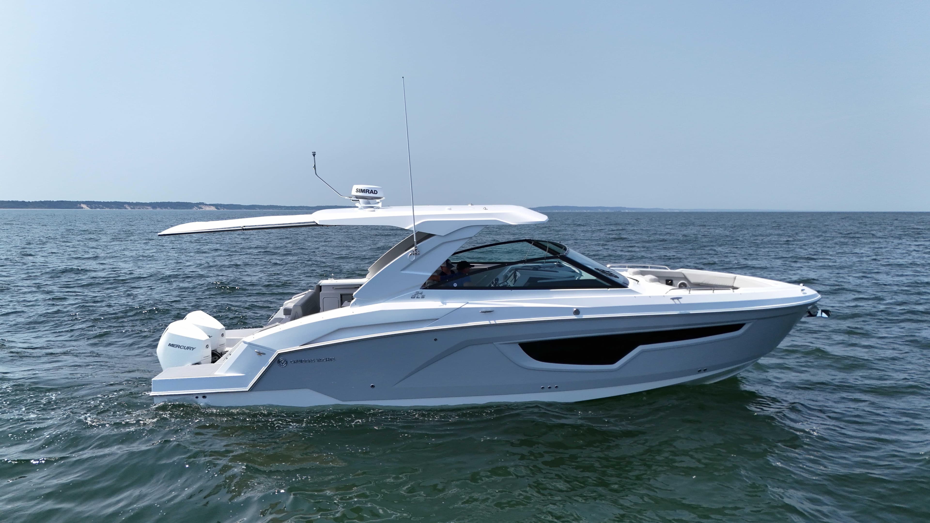 2025 Cruisers Yachts 34 GLS Outboard on open water, side view.