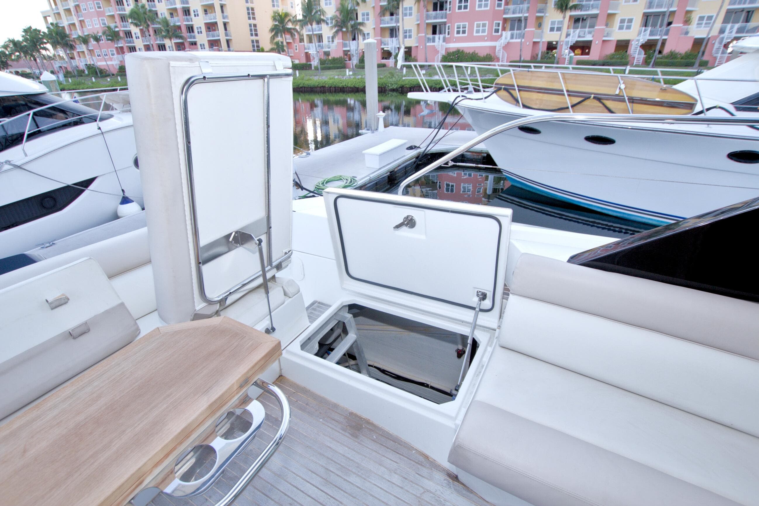 2019 Beneteau Gran Turismo 50 yacht interior with open storage compartments and seating area.