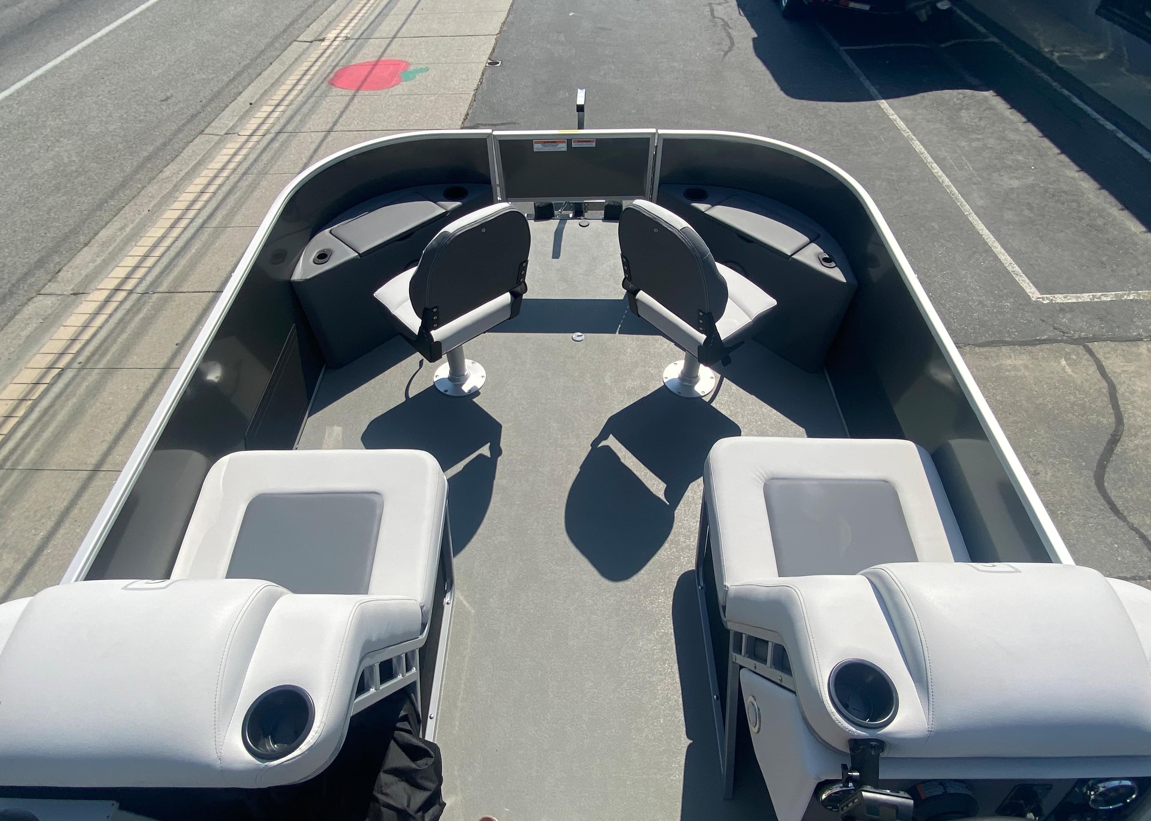 2023 Godfrey MIGHTY G 1476F boat interior with seating and storage compartments.