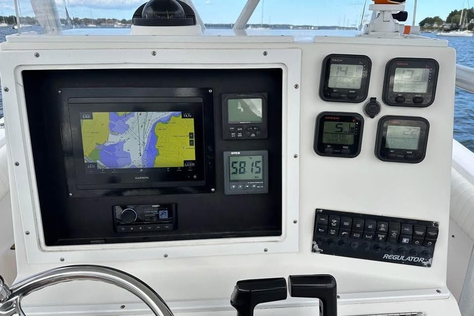 Control panel of a 2006 Regulator 24 Forward Seating boat with navigation and gauges.