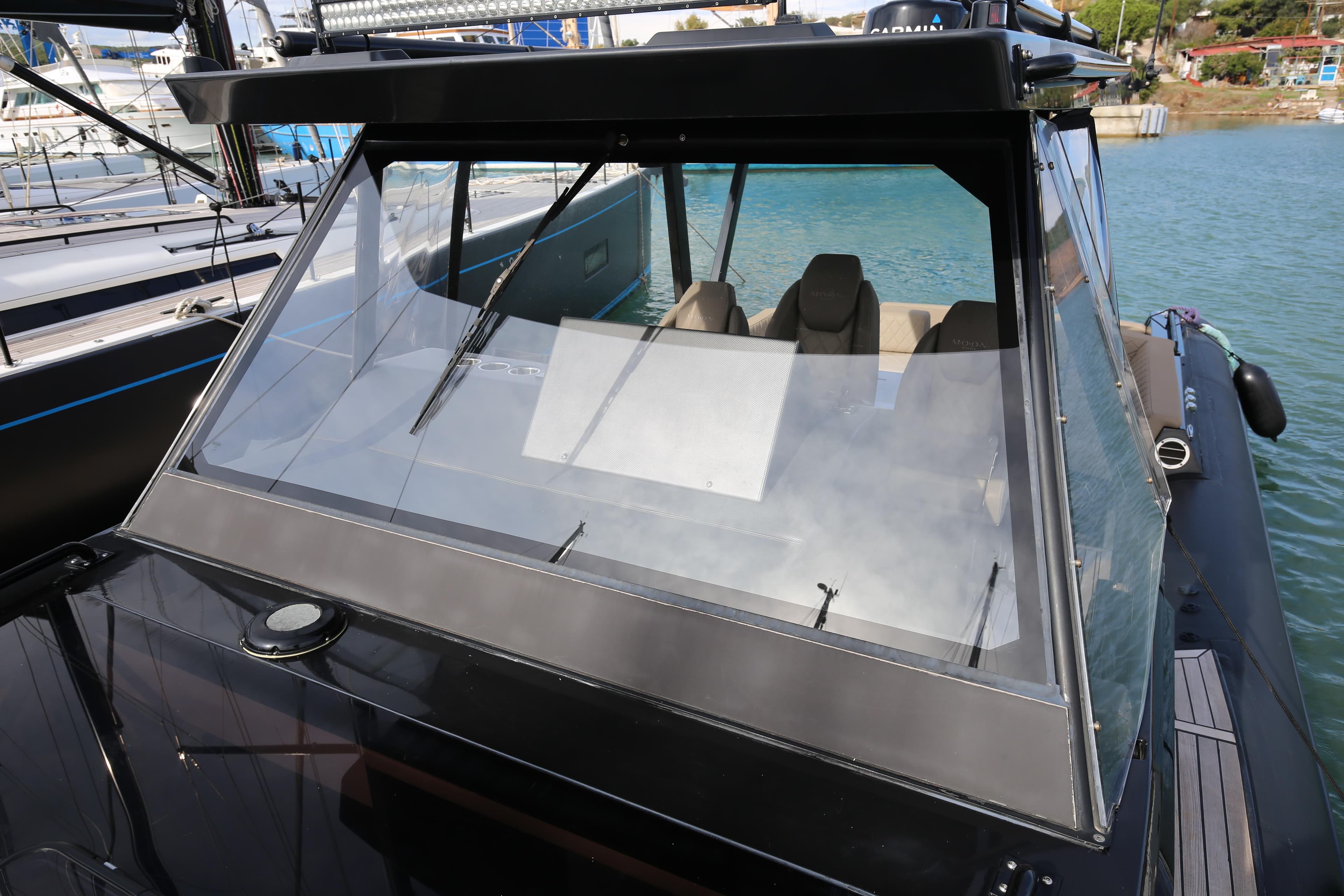 Modern Moon 45 boat, 2022 model, with sleek design and spacious interior, docked at marina.