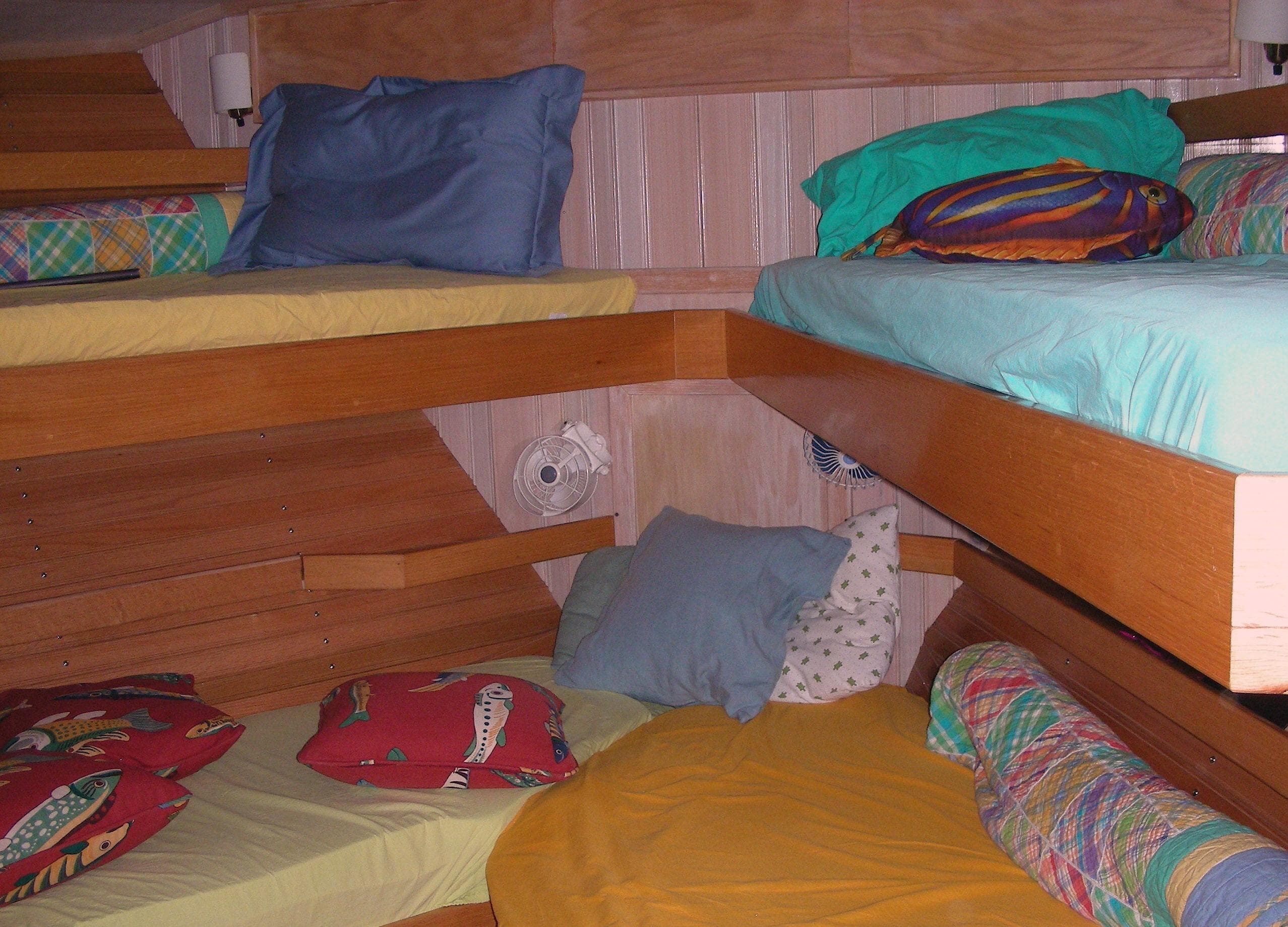 Cozy cabin interior with colorful bedding in a 2000 Expedition custom model.