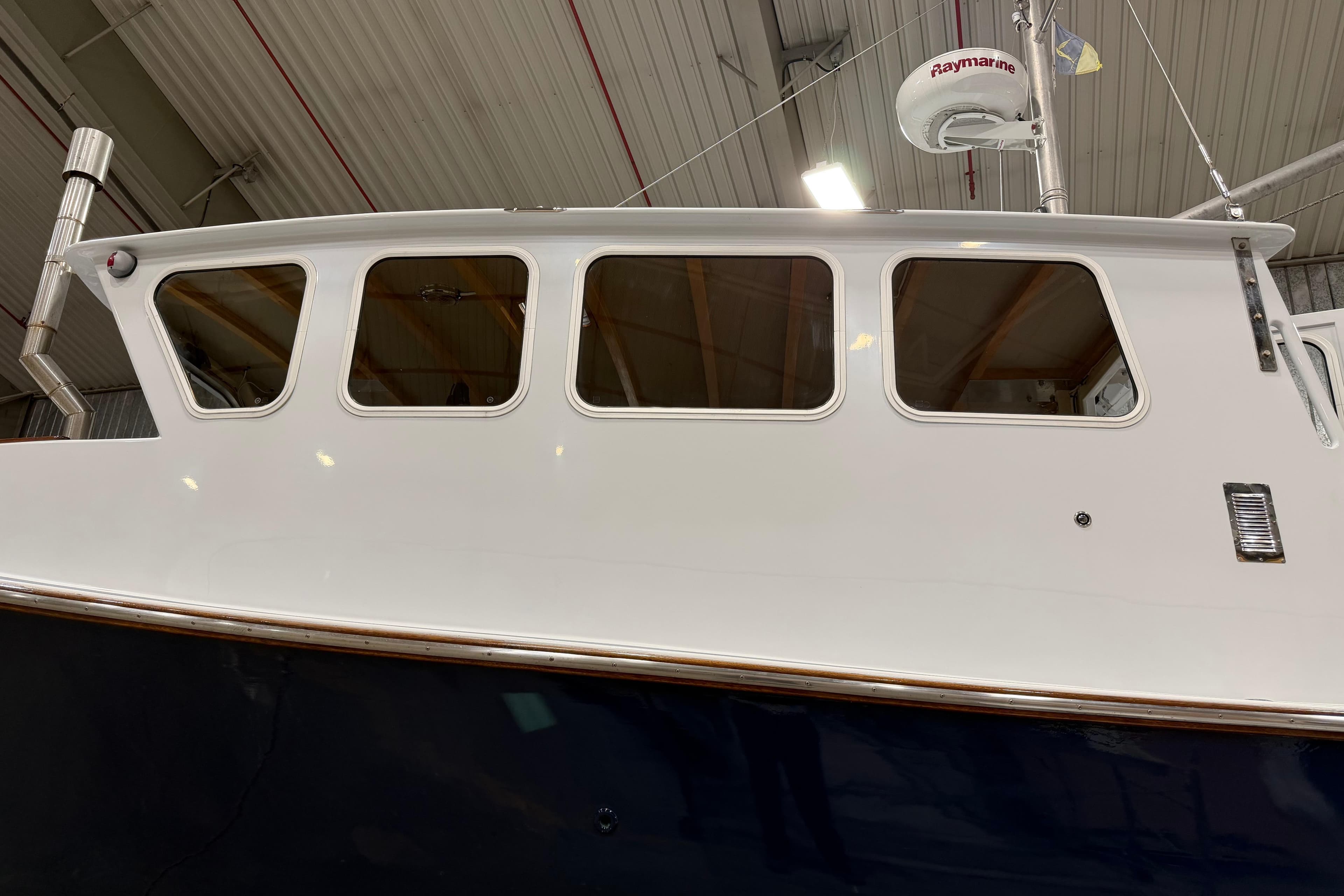 2022 Covey Island 38 Lobster Yacht in a boatyard, side view.
