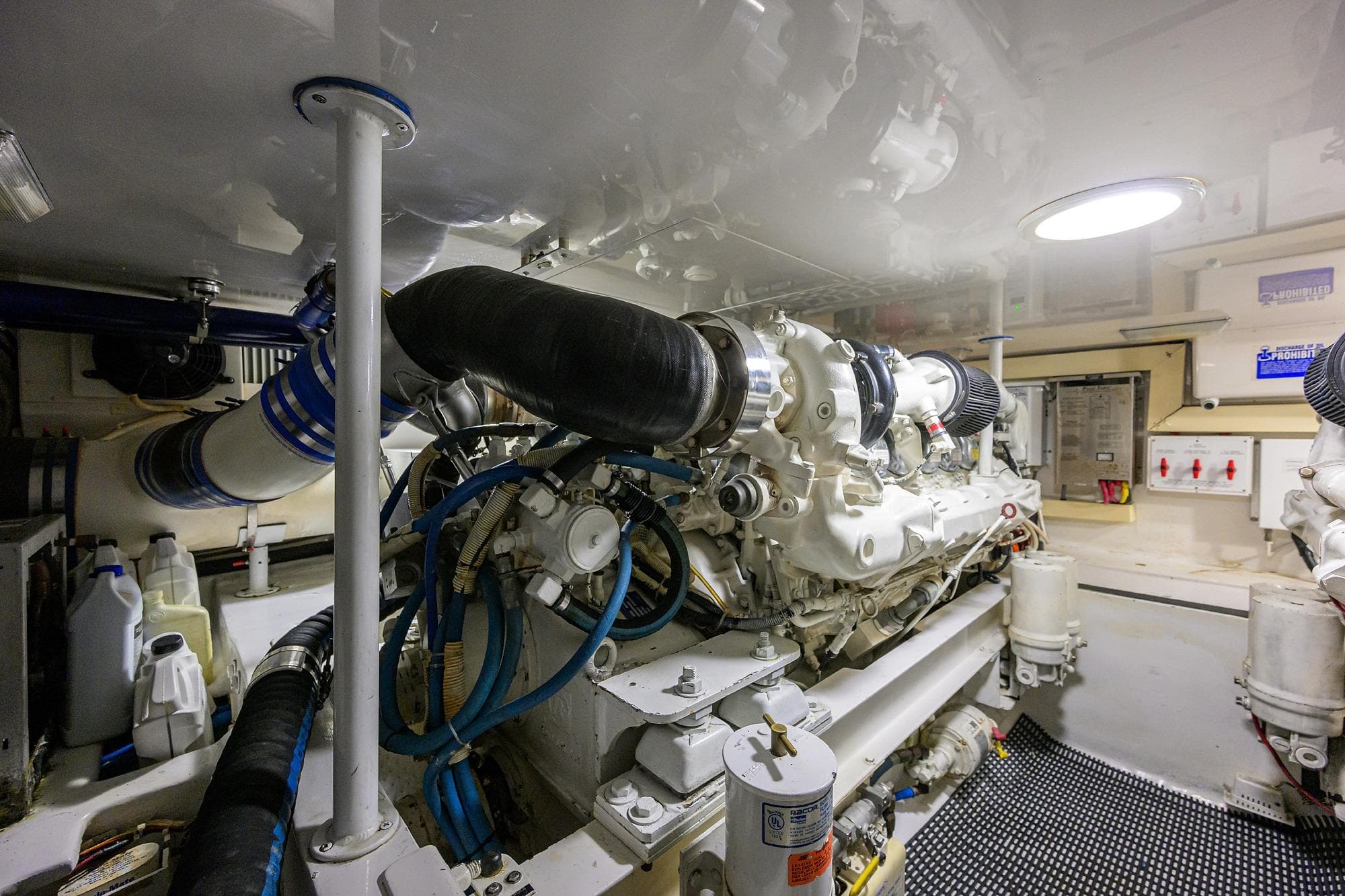 Engine room of a 2004 Viking 48 Convertible yacht, showcasing machinery and components.