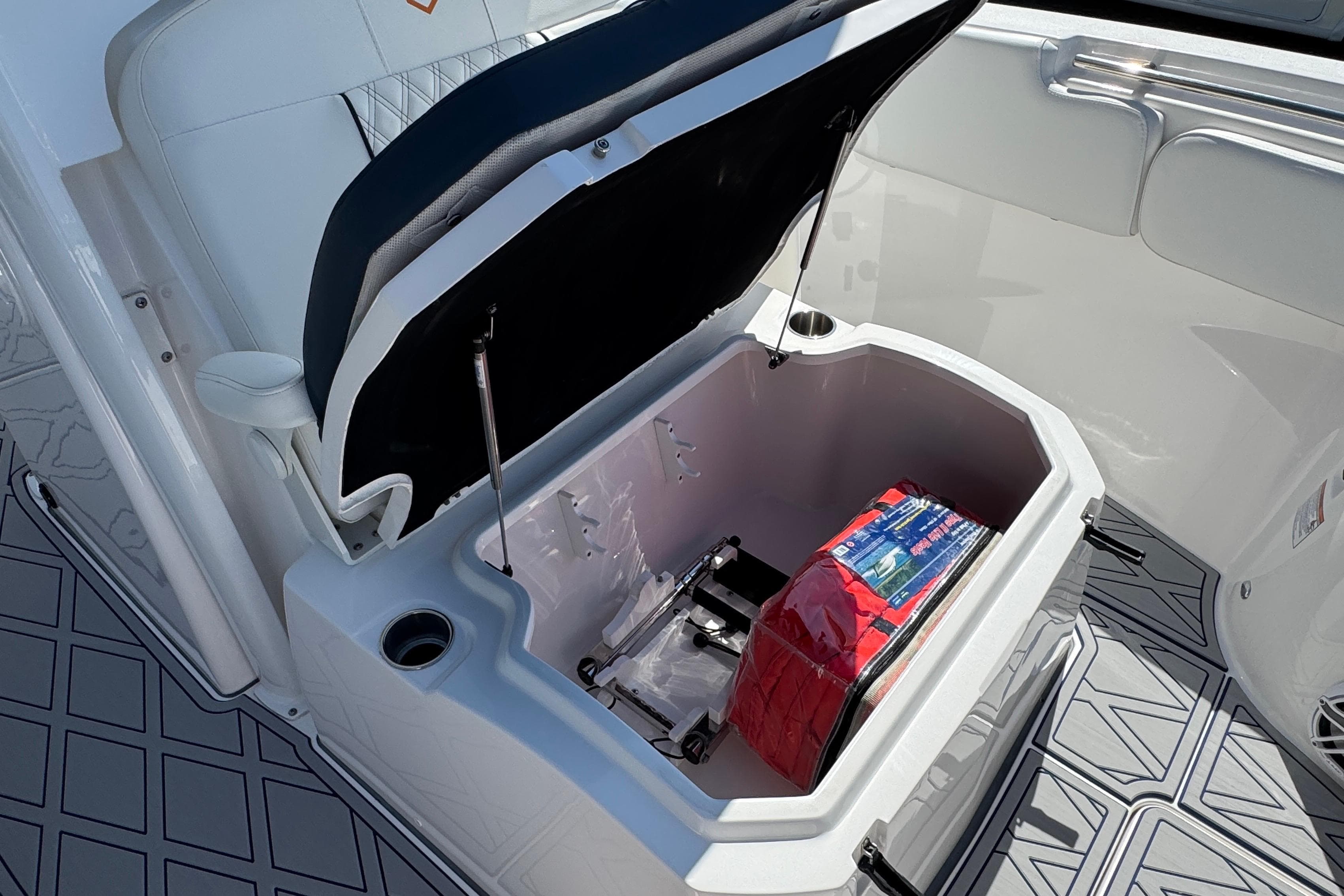 2025 Sea Fox 288 Commander boat storage compartment with safety equipment inside.