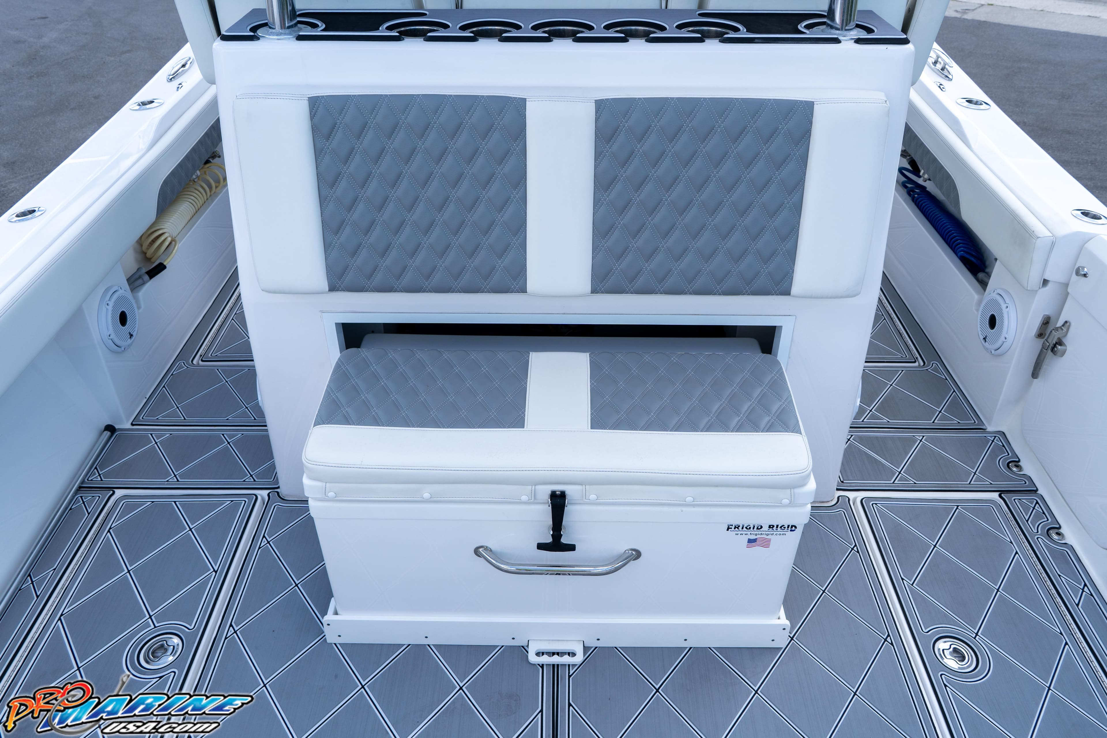 2023 Front Runner 36 Center Console boat interior with cushioned seating and storage.