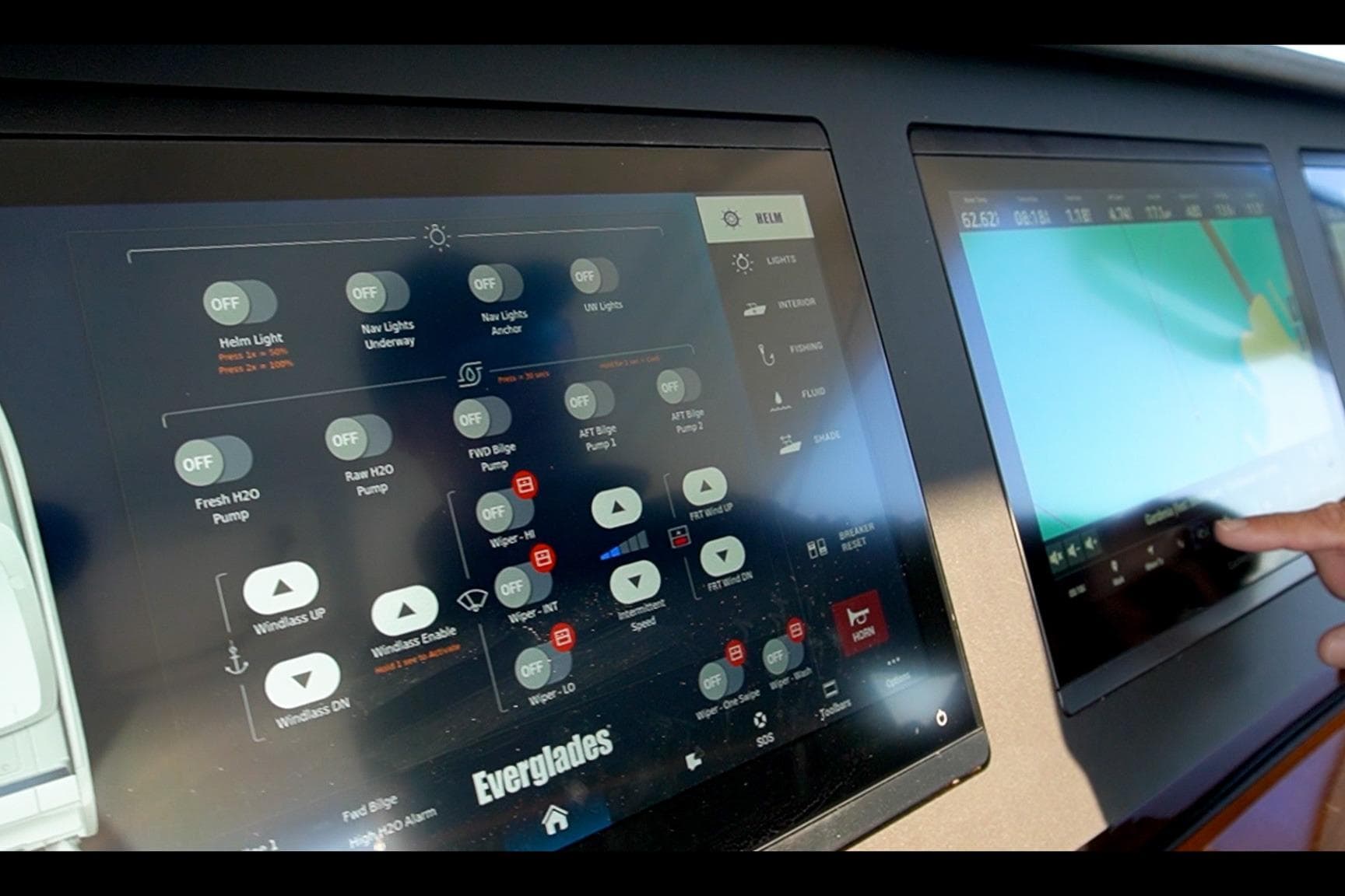 Touchscreen controls on 2024 Everglades 395 Center Console boat dashboard.