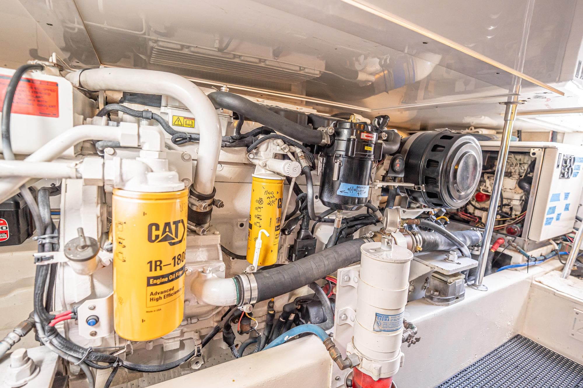 Engine room of 2007 Egg Harbor 43 SportYacht with CAT components and detailed machinery.