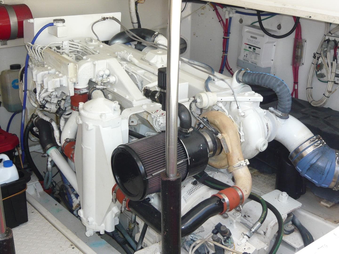 Engine room of a 2004 Rampage 38 Express boat, showcasing detailed mechanical components.