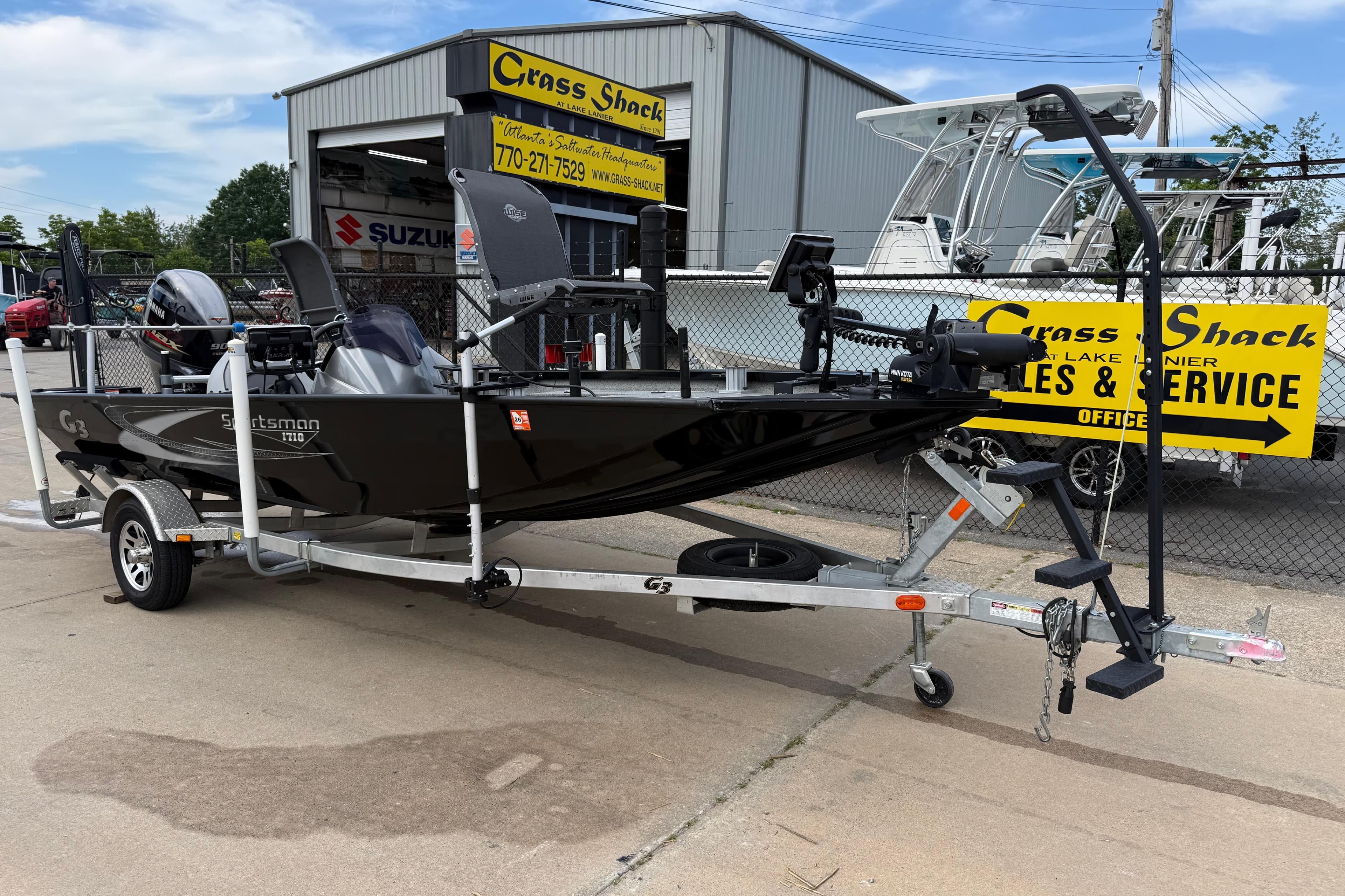 2019 G3 Sportsman 1710 PFX boat on trailer at dealership.
