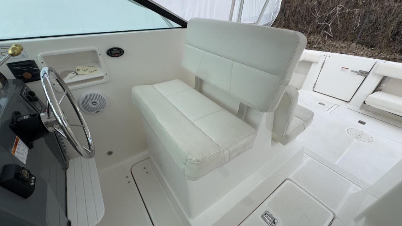 2005 Tiara Yachts 2900 Open interior with white seating and steering wheel.