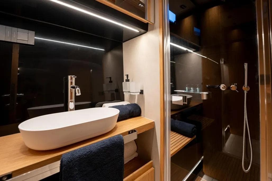 Luxurious bathroom interior of 2026 De Antonio Yachts D60, featuring modern sink and shower.