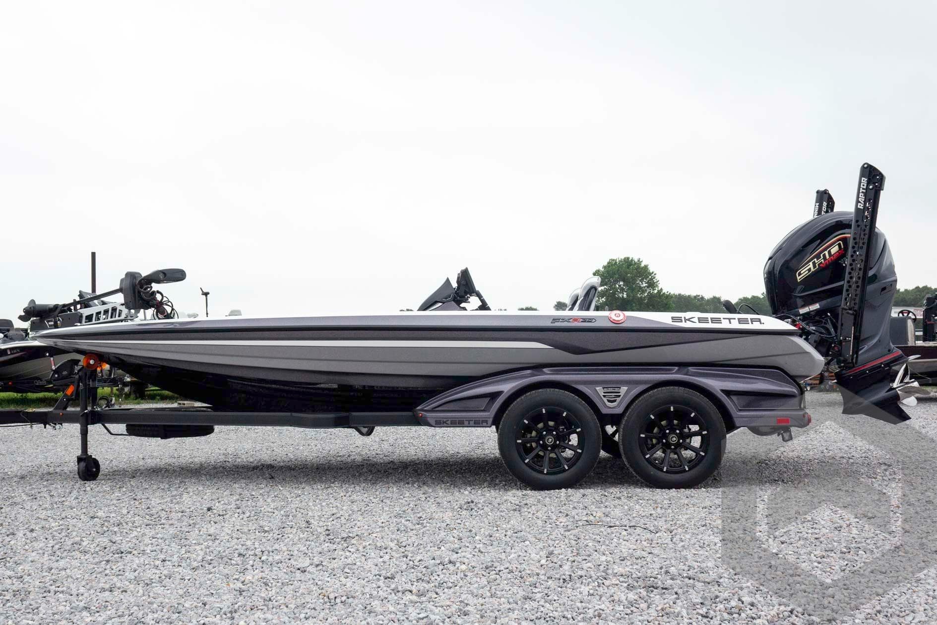 2026 Skeeter FXR20 FLEX boat on trailer, side view, outdoors.
