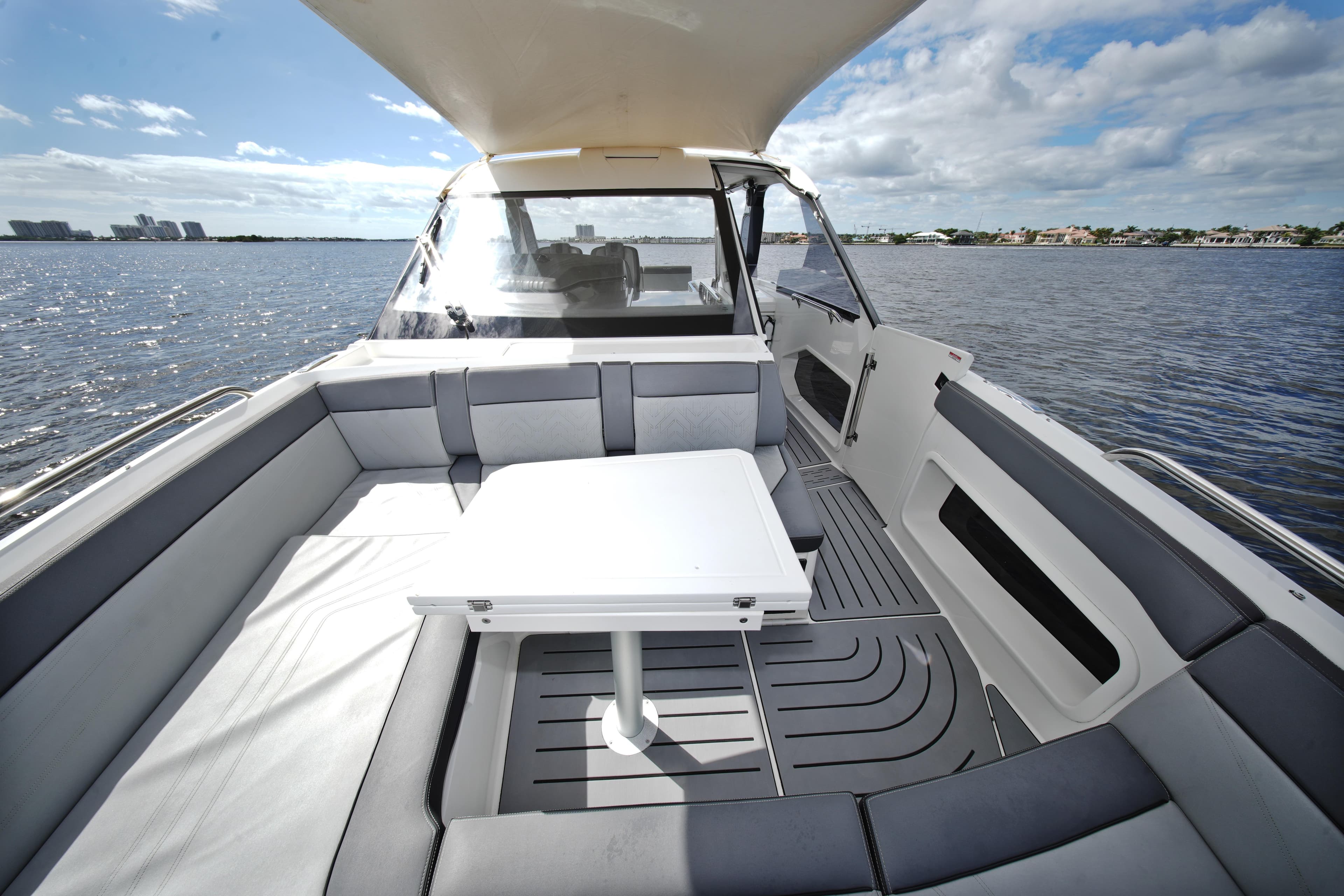 2023 Galeon 400 XL yacht interior with seating and table on open water.