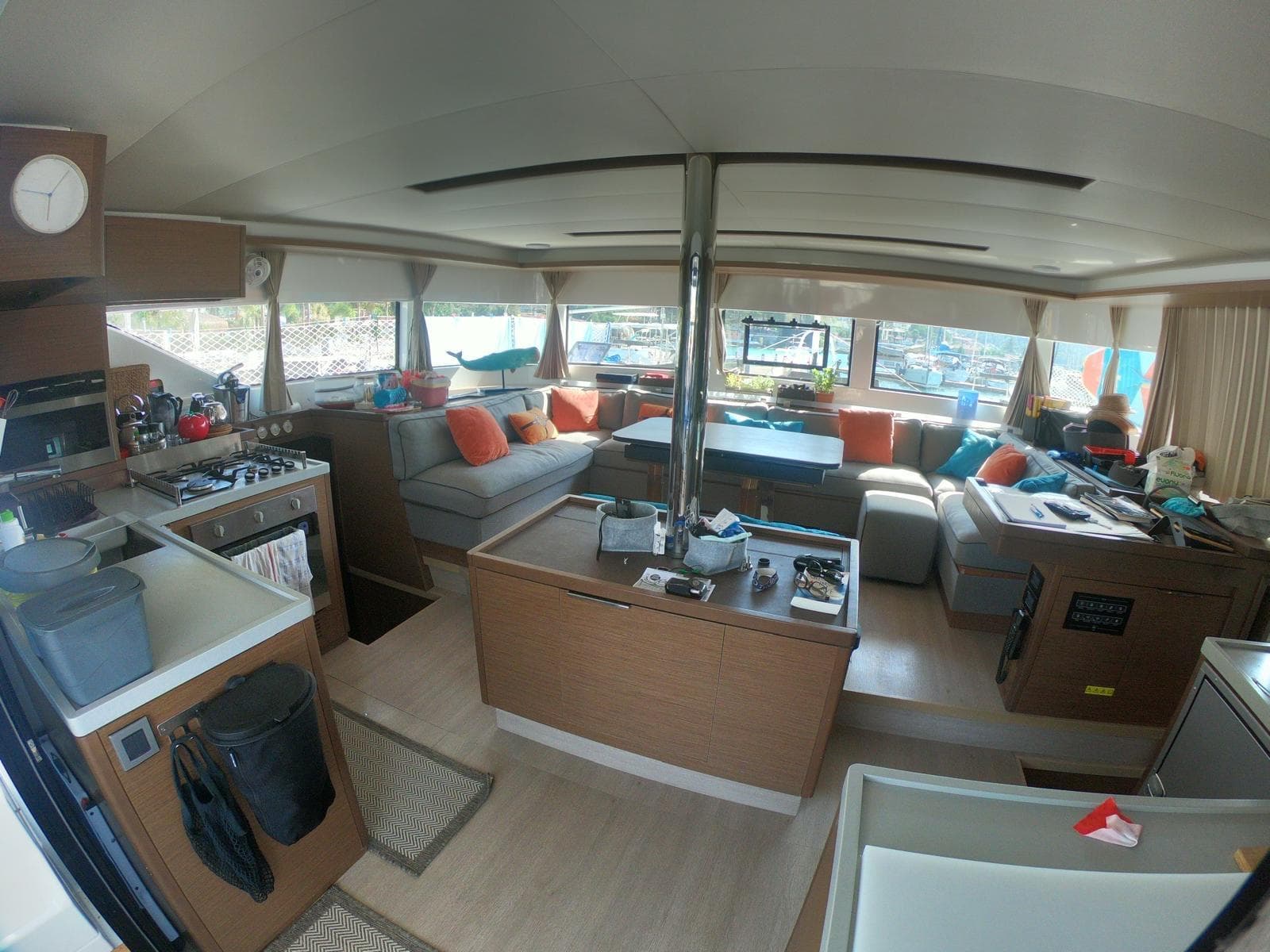 Spacious interior of 2019 Lagoon 50 catamaran with modern furnishings and ample seating.