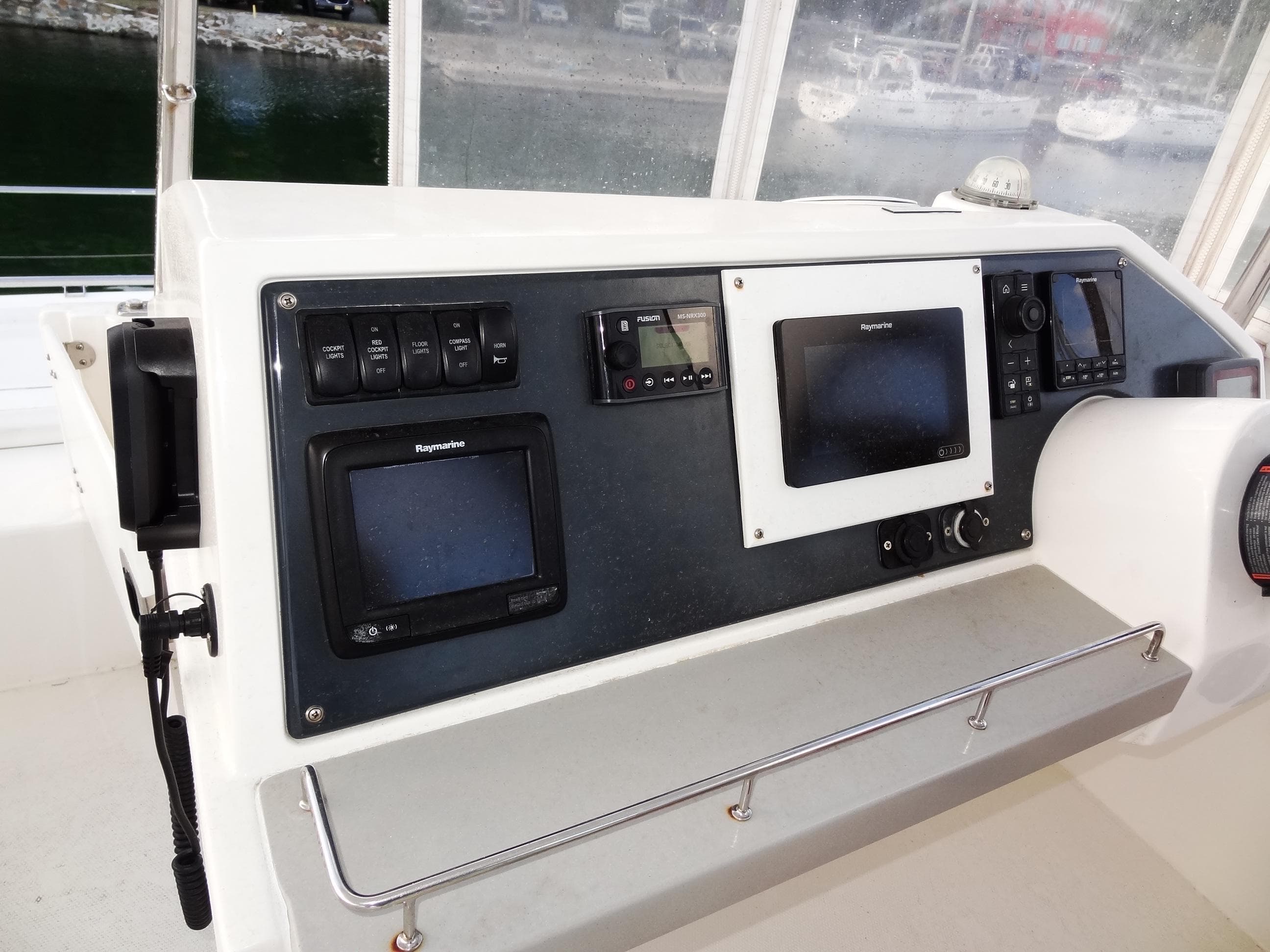 Control panel of a 2018 Leopard 43 Powercat with navigation screens and instruments.