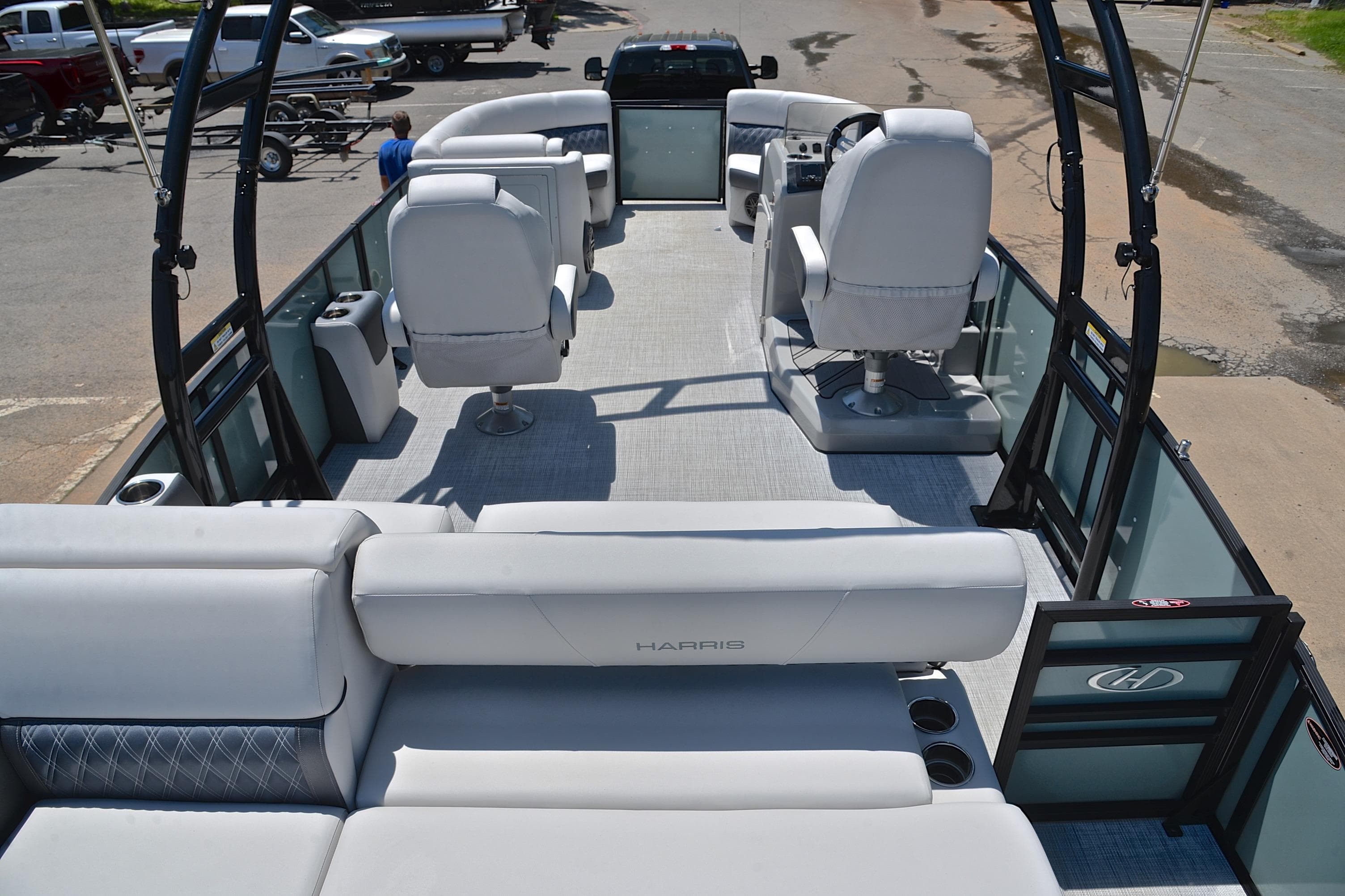 2023 Harris Sunliner 230 pontoon boat interior with plush seating and modern helm.