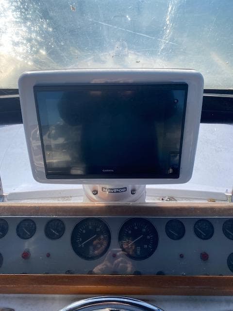 Dashboard of 1989 Ocean Alexander 42 yacht with navigation screen and gauges.