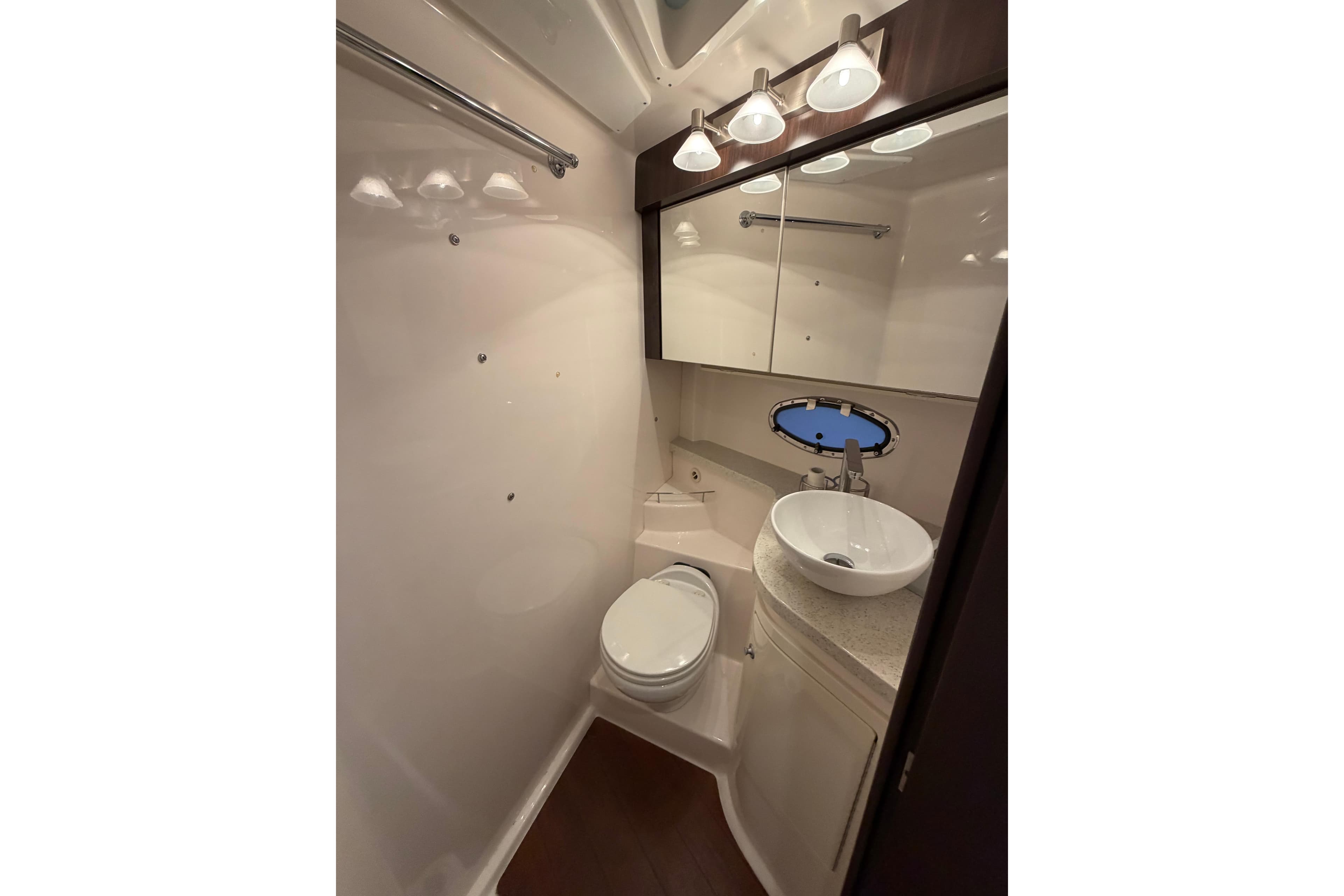 Luxurious bathroom in 2018 Regal 42 Sport Coupe yacht, featuring modern fixtures and elegant design.