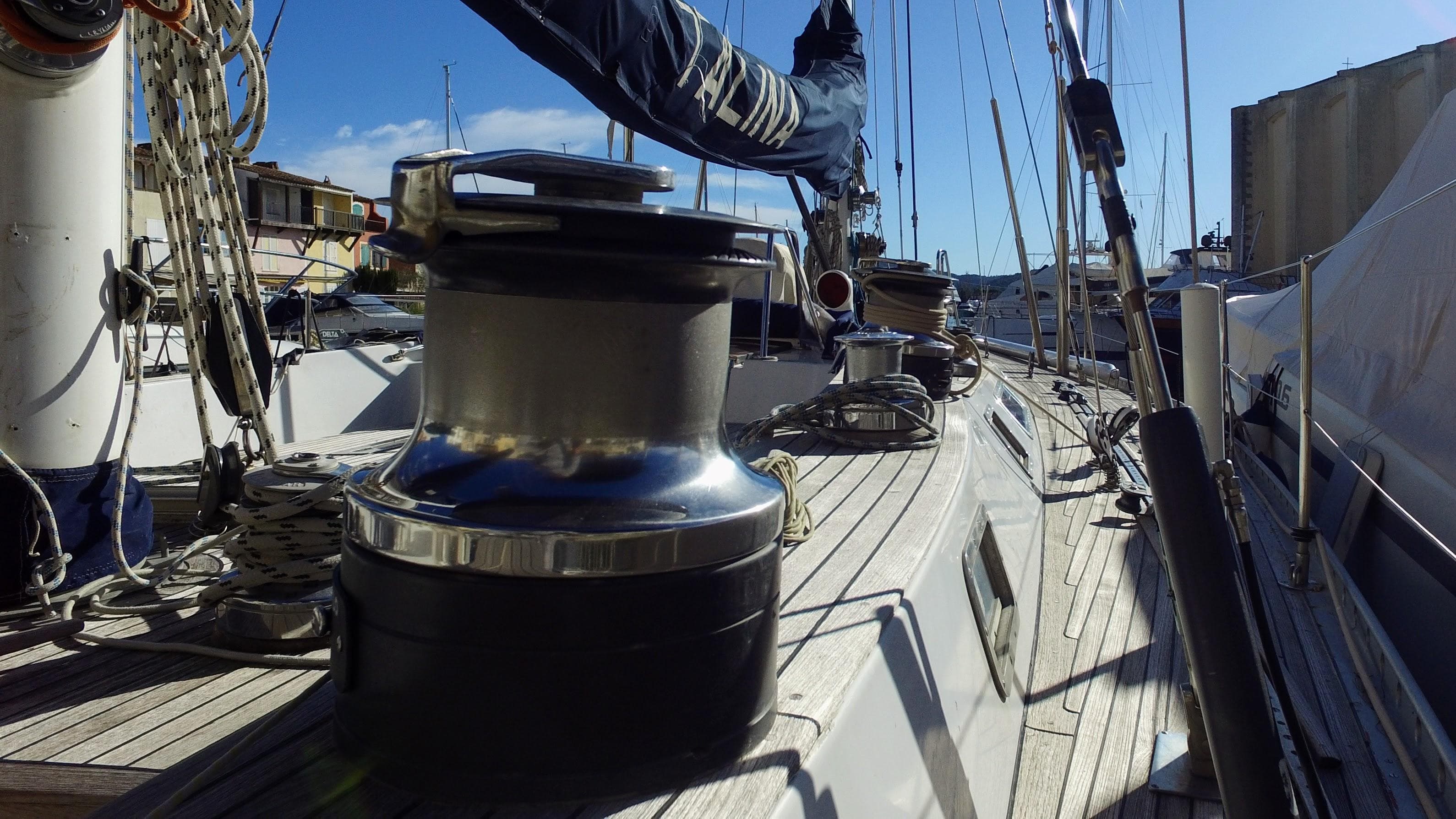 Deck view of a 1975 Nautor Swan 65 sailboat, showcasing winches and rigging.