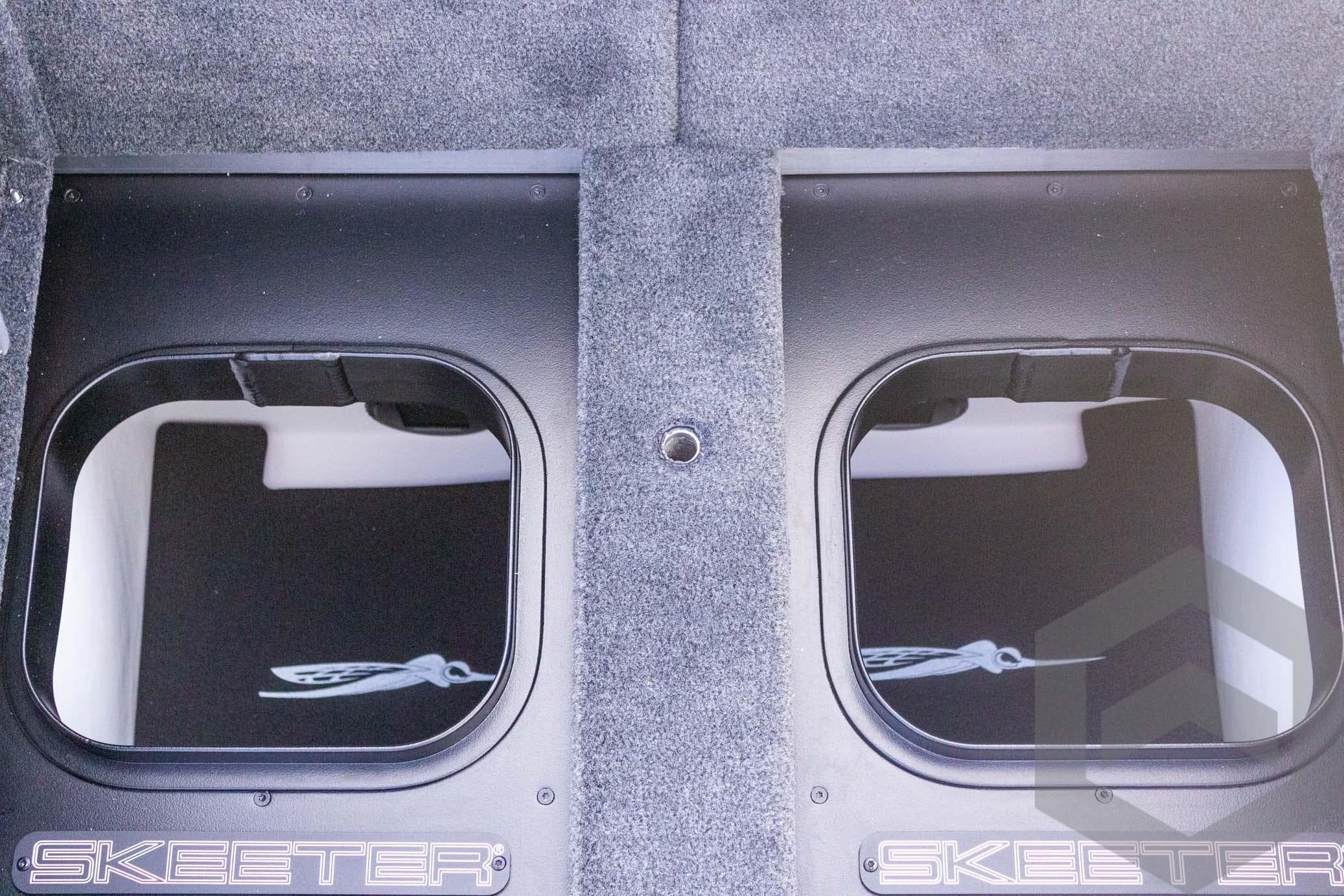 2026 Skeeter FXR21 FLEX boat storage compartments with carpeted interior.