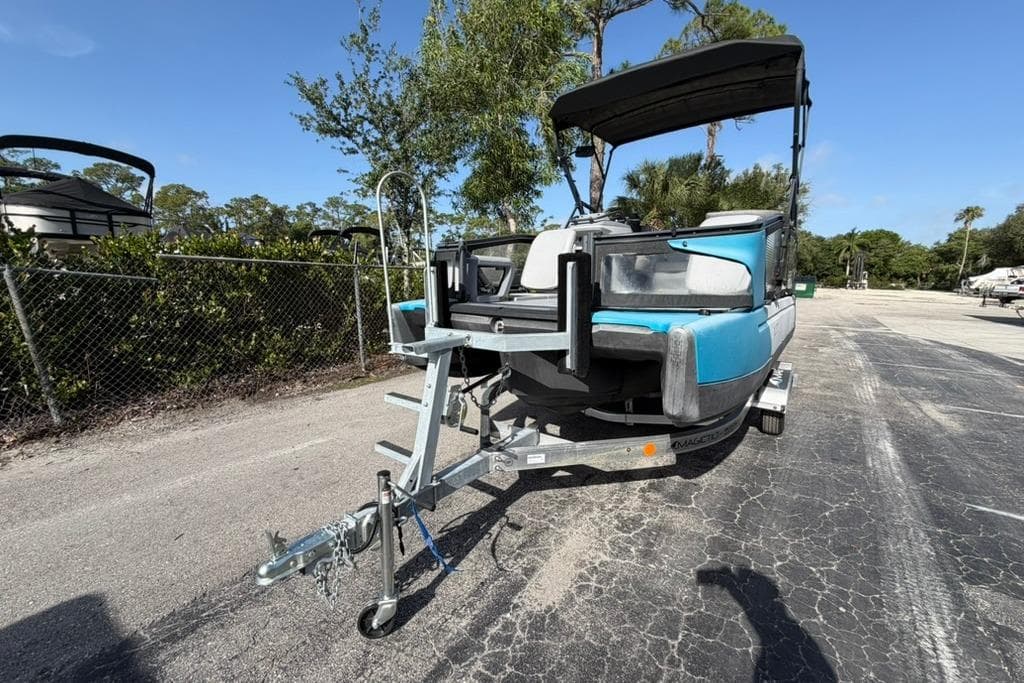 2022 Sea-Doo Switch Sport 18 on trailer, parked outdoors under clear sky.