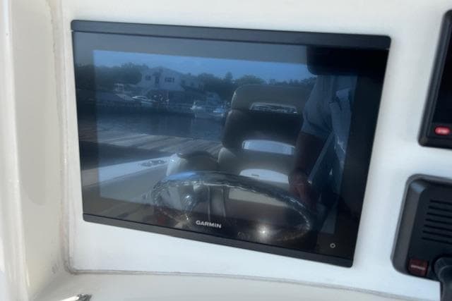 Garmin display on 2006 Boston Whaler 320 Outrage Cuddy Cabin boat dashboard.