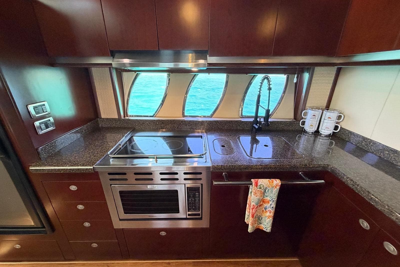 Luxurious kitchen interior of 2006 Sea Ray 480 Sundancer yacht with modern appliances.