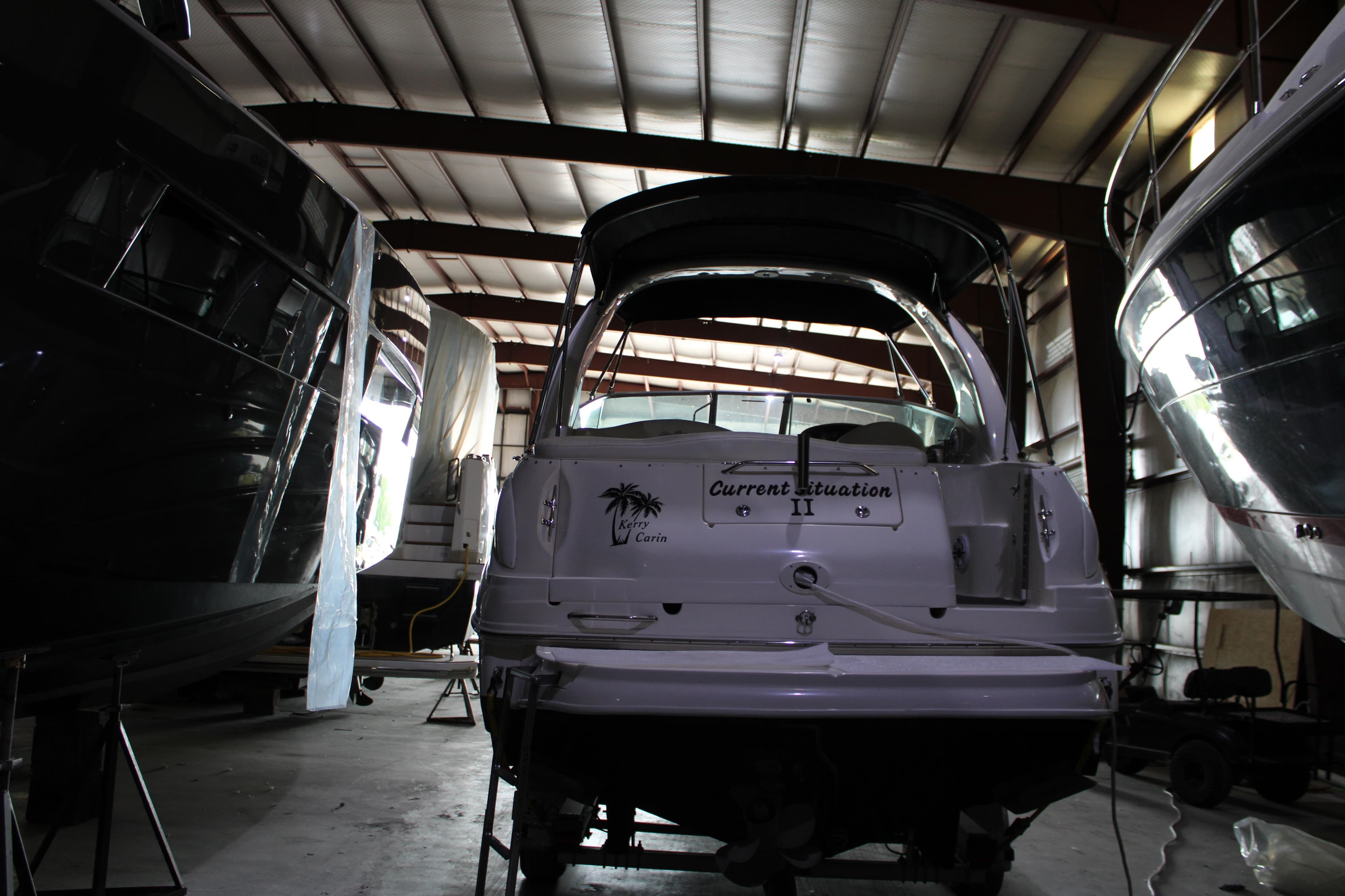 2004 Sea Ray Sundancer 280 boat in storage, rear view, indoor facility.