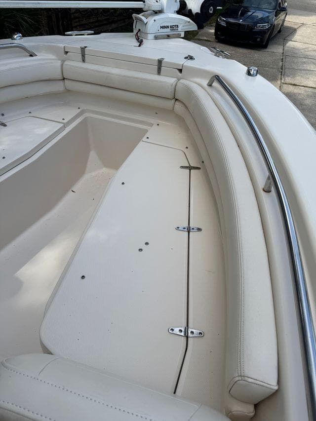 2017 Grady-White Fisherman 257 boat interior with cushioned seating and storage compartments.
