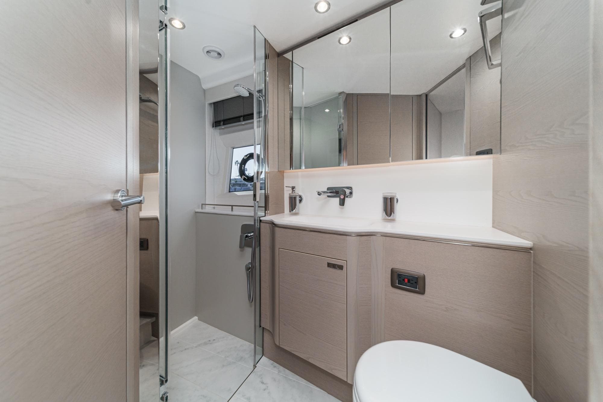 Luxurious bathroom interior of 2026 Princess V55 yacht, featuring modern fixtures and elegant design.