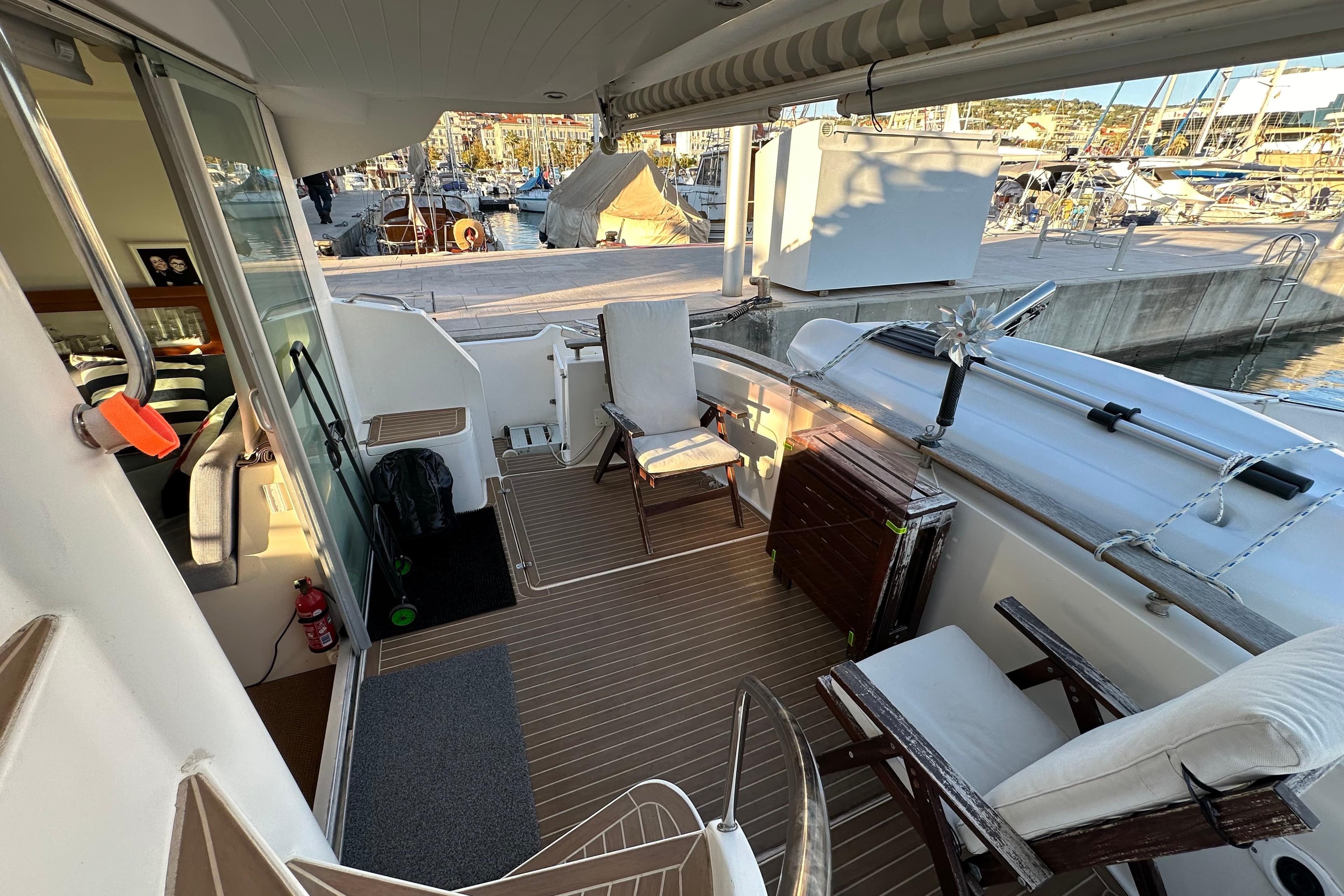 1999 Fountaine Pajot Maryland 37 yacht deck with seating, docked at marina.