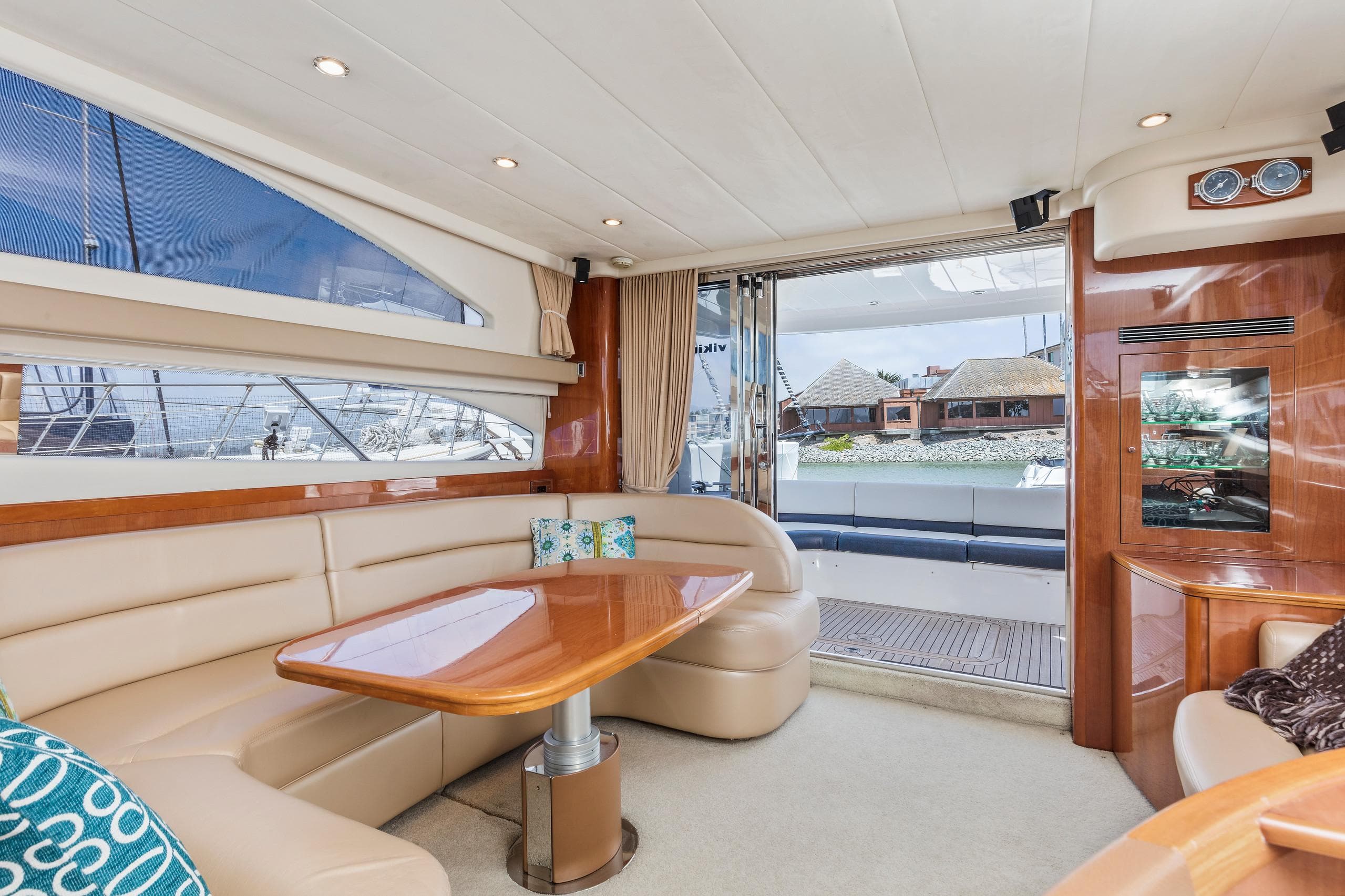 Luxurious interior of a 2007 Viking Sport Cruiser yacht with elegant seating and wooden accents.