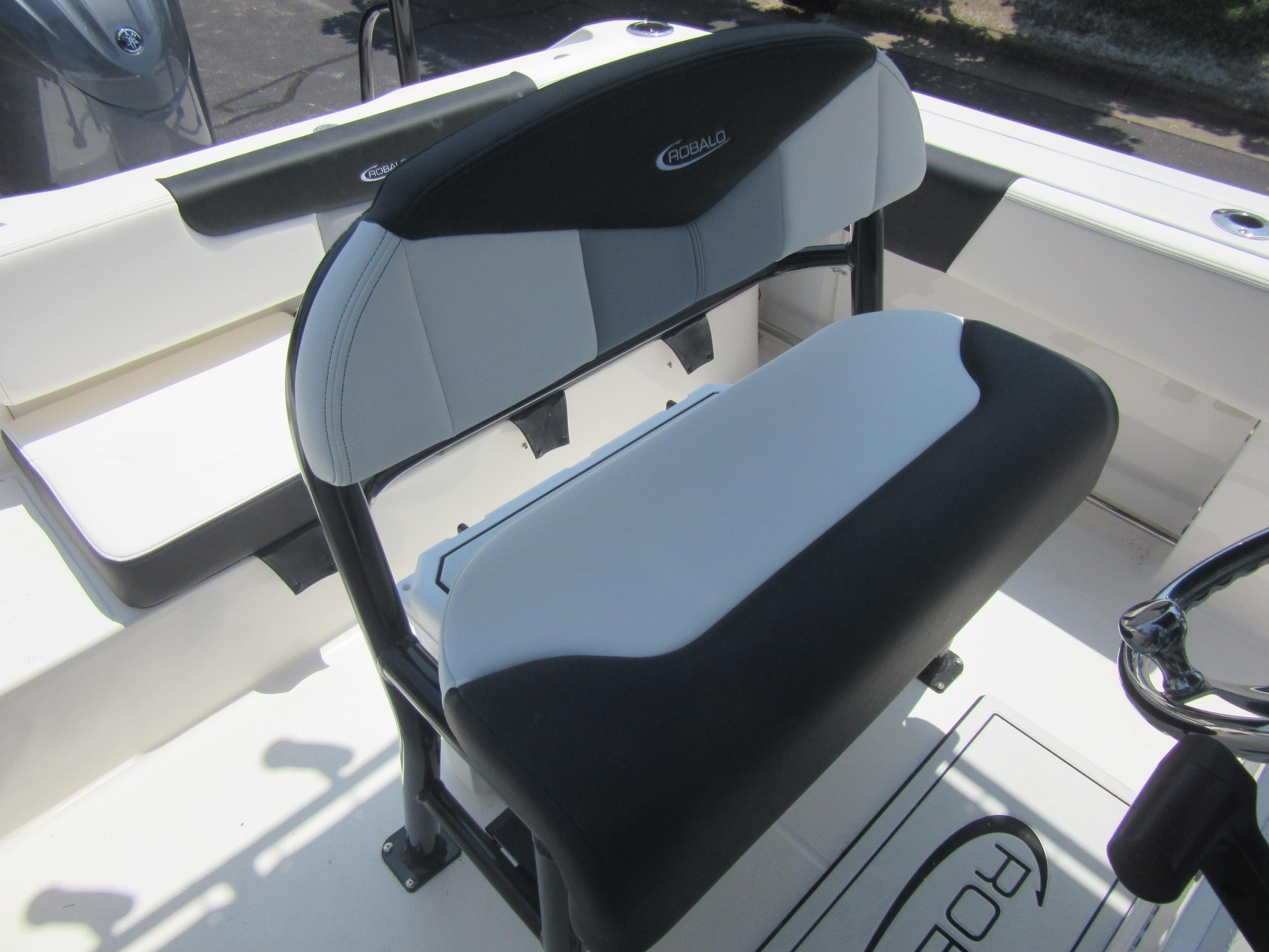2025 Robalo R202 Explorer boat seating with black and white upholstery.