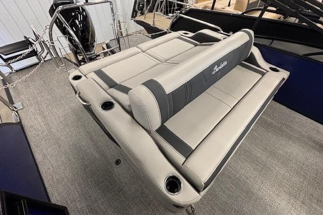 2026 Barletta Corsa 23UC boat interior with luxurious seating and cup holders.