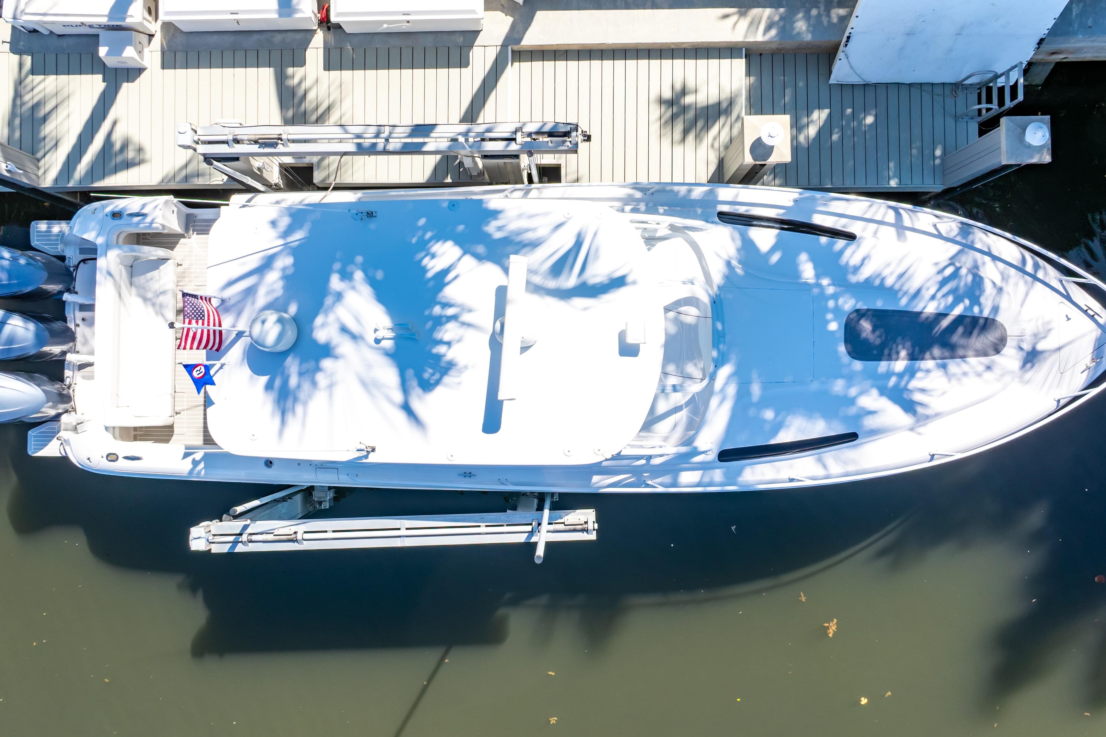 Overhead view of 2016 Intrepid 400 Cuddy boat docked by a pier.