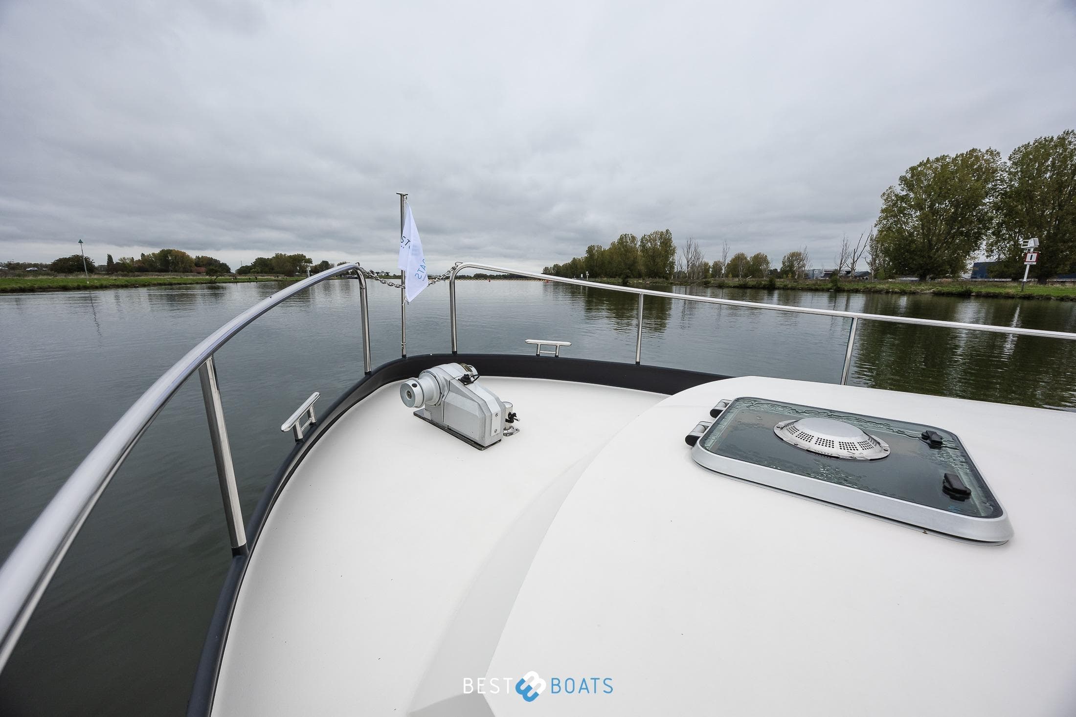Linssen Grand Sturdy 34.9 AC yacht bow view on a calm river, 2010 model.
