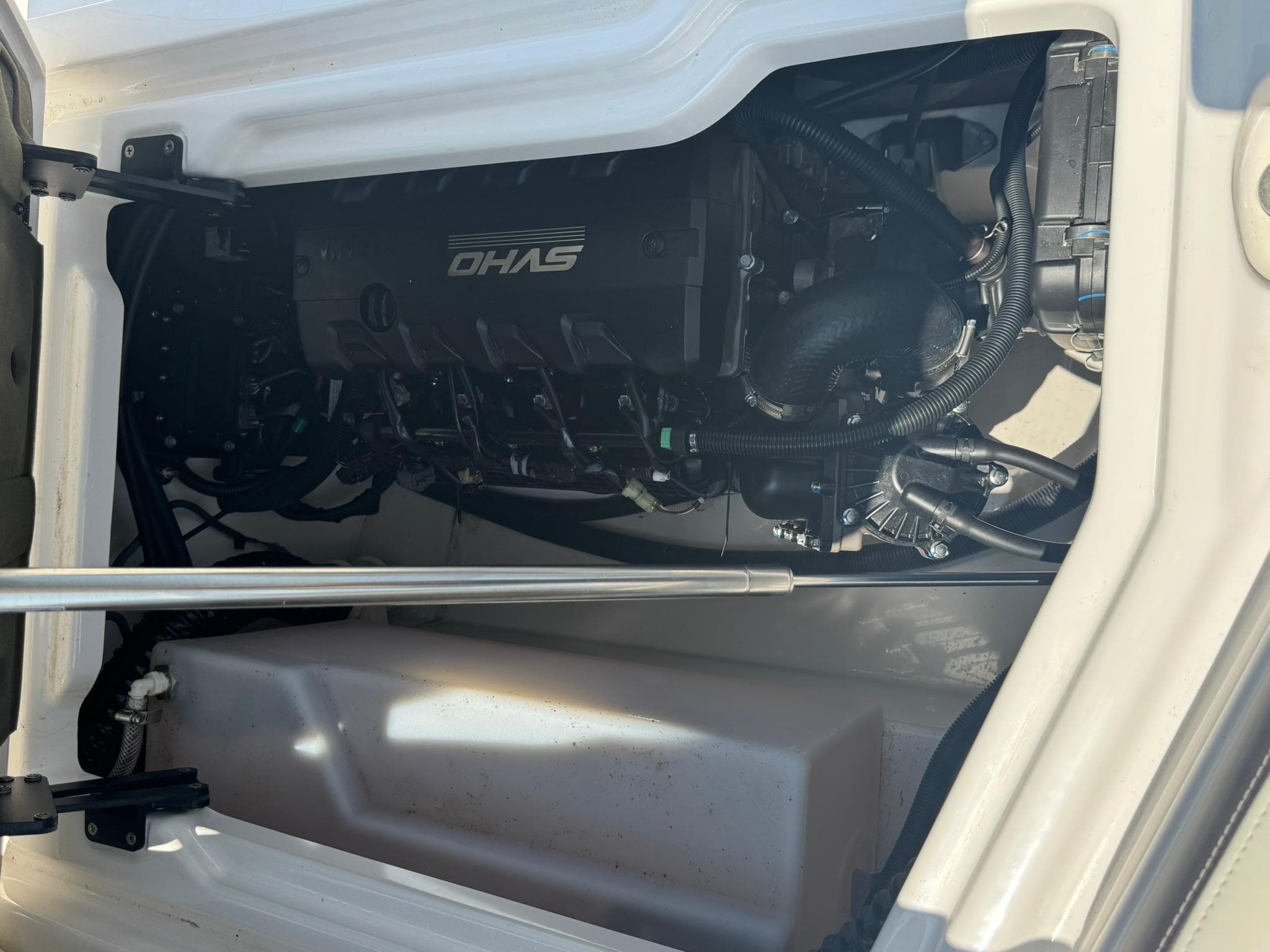 Engine compartment of 2022 Yamaha Boats 275SD, showcasing internal components and wiring.