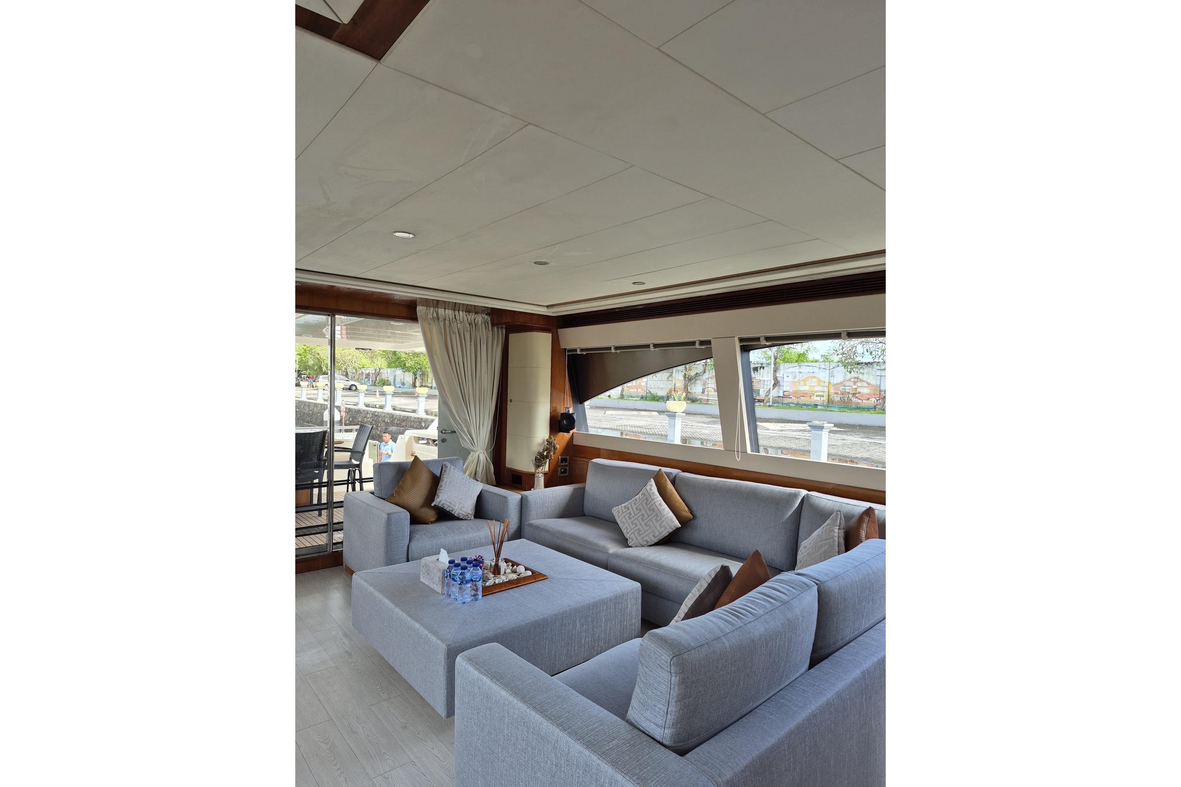 Luxurious interior of 2006 Ferretti Yachts 830 with elegant seating and large windows.