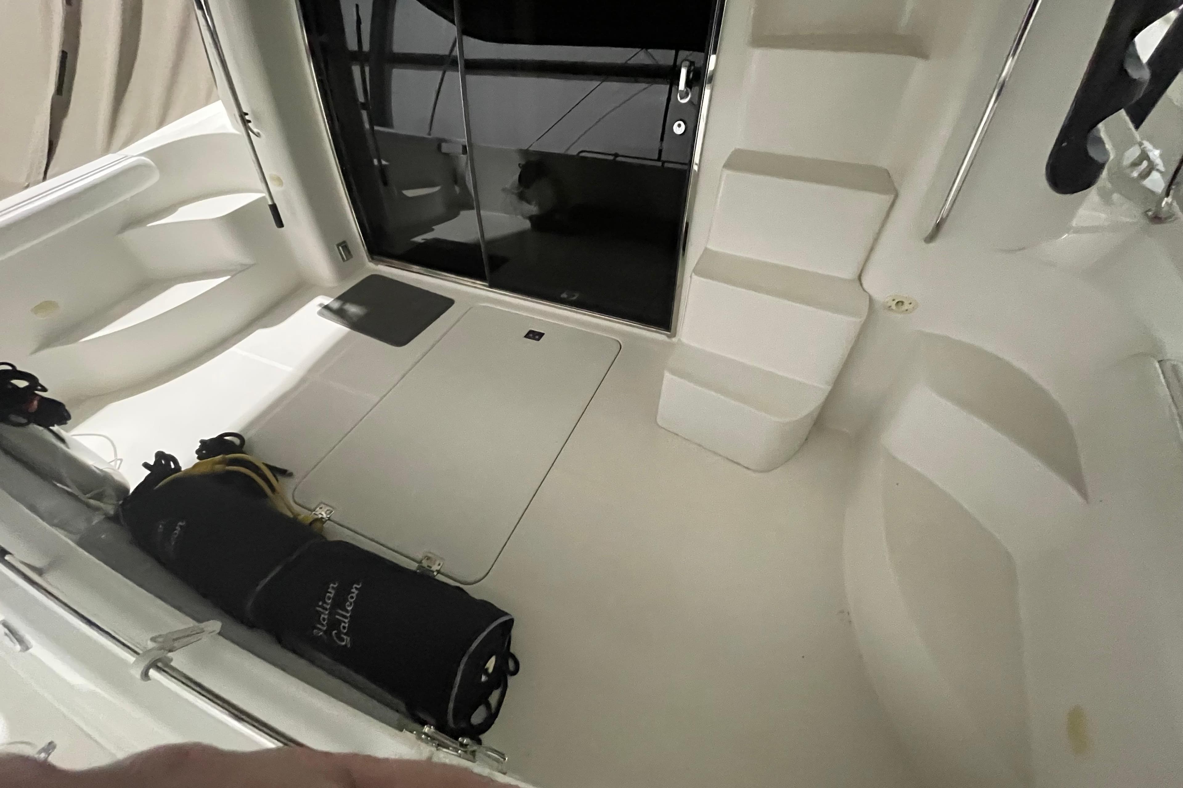 2004 Carver 460 Voyager yacht interior with steps and storage area.