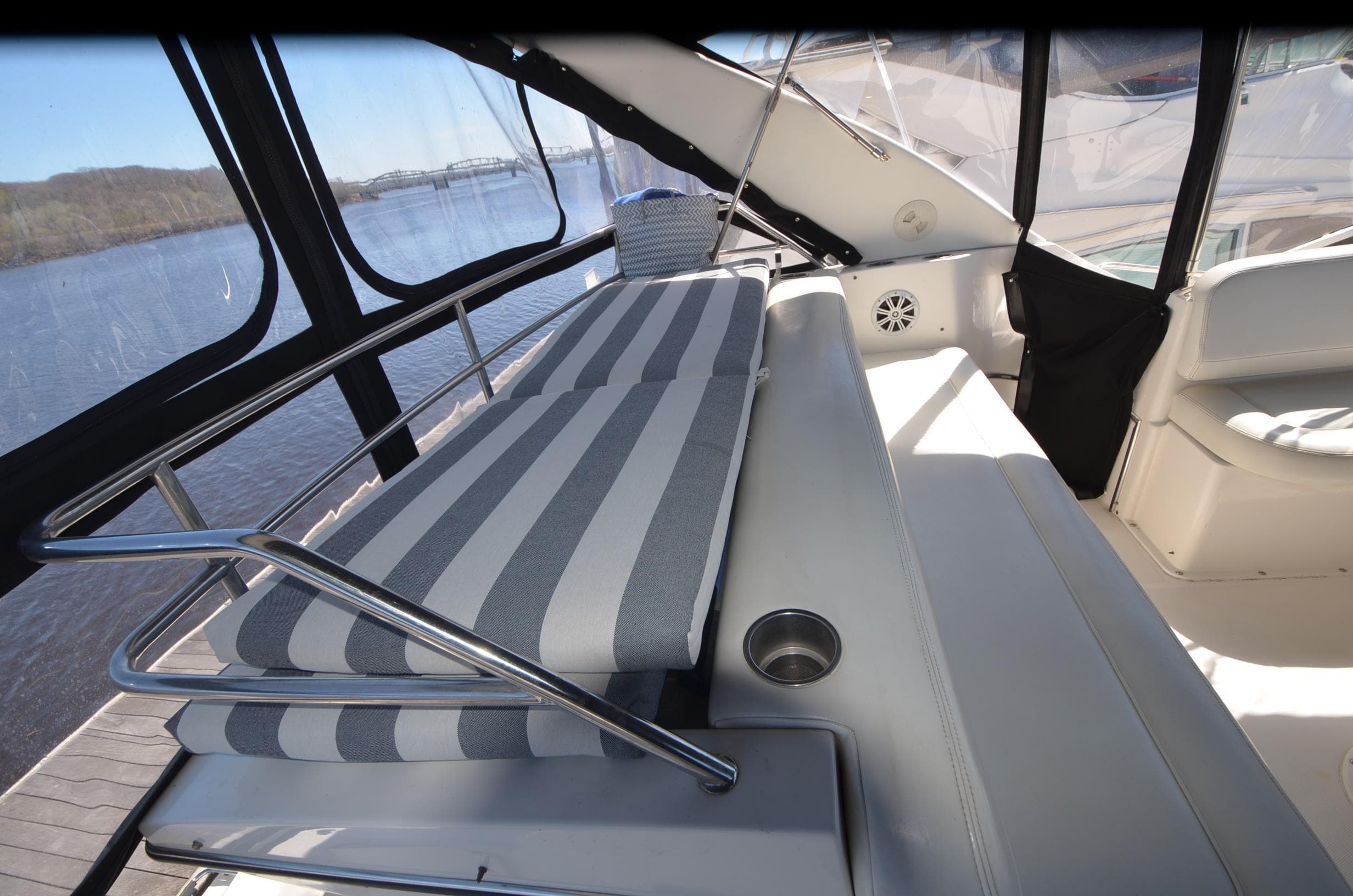 2000 Silverton 330 Sport Bridge interior with striped seating and panoramic windows.