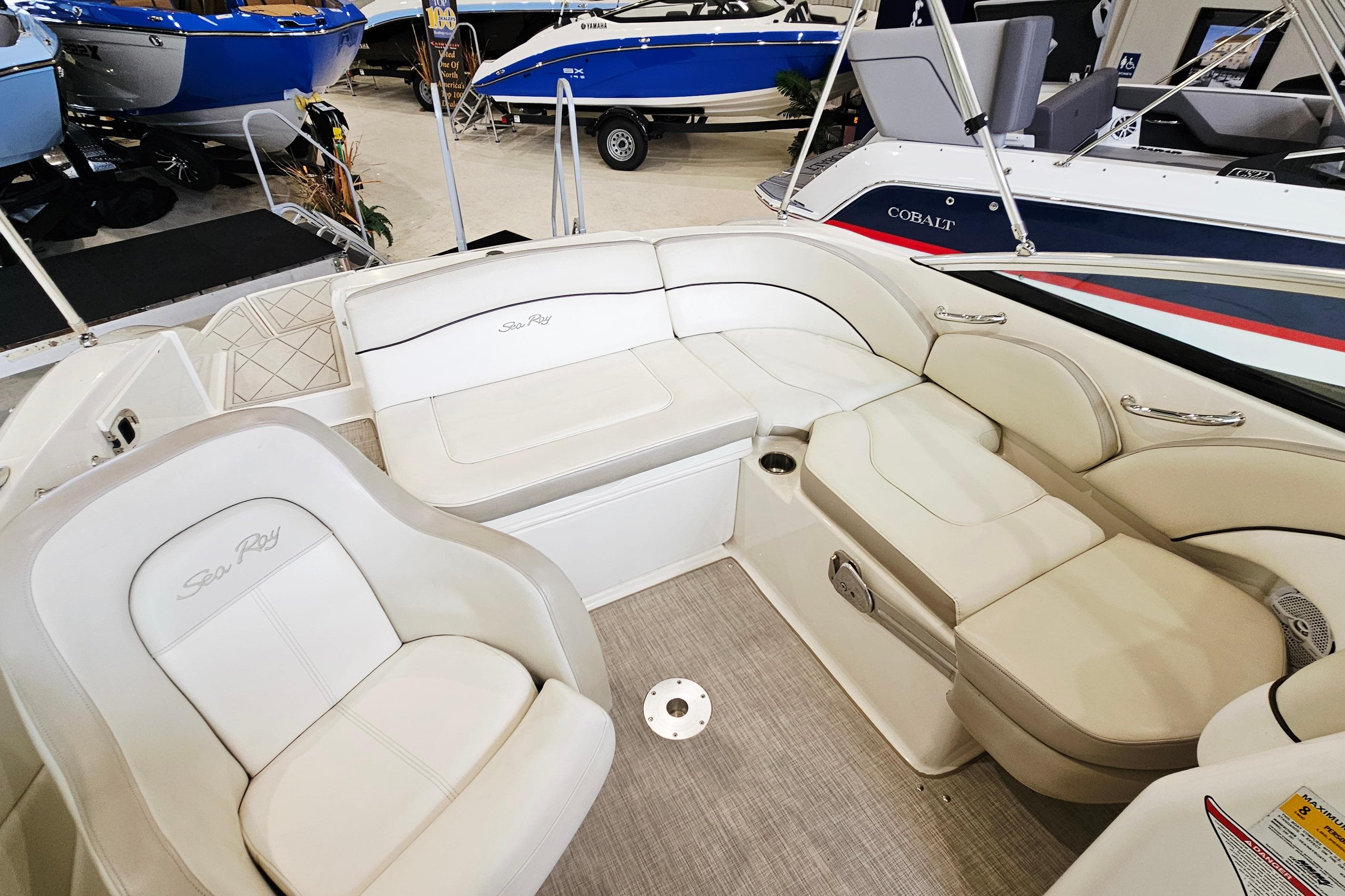 2012 Sea Ray 200 Sundeck interior with white seating and elegant design.