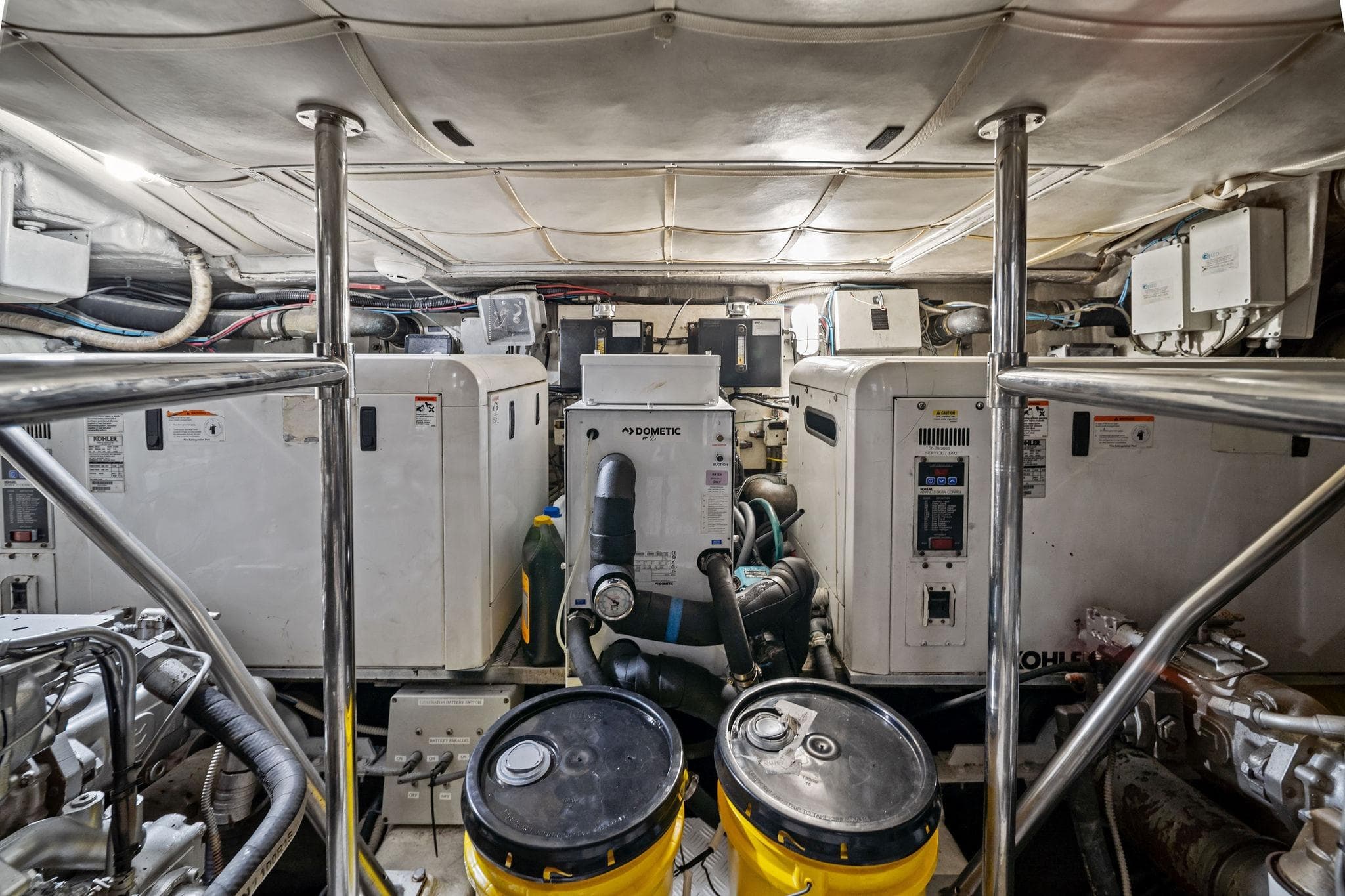 Engine room of a 2013 Pershing 82 yacht, featuring machinery and equipment.