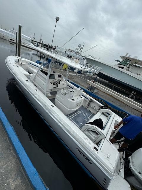 2008 Intrepid Open boat docked at marina on a cloudy day.