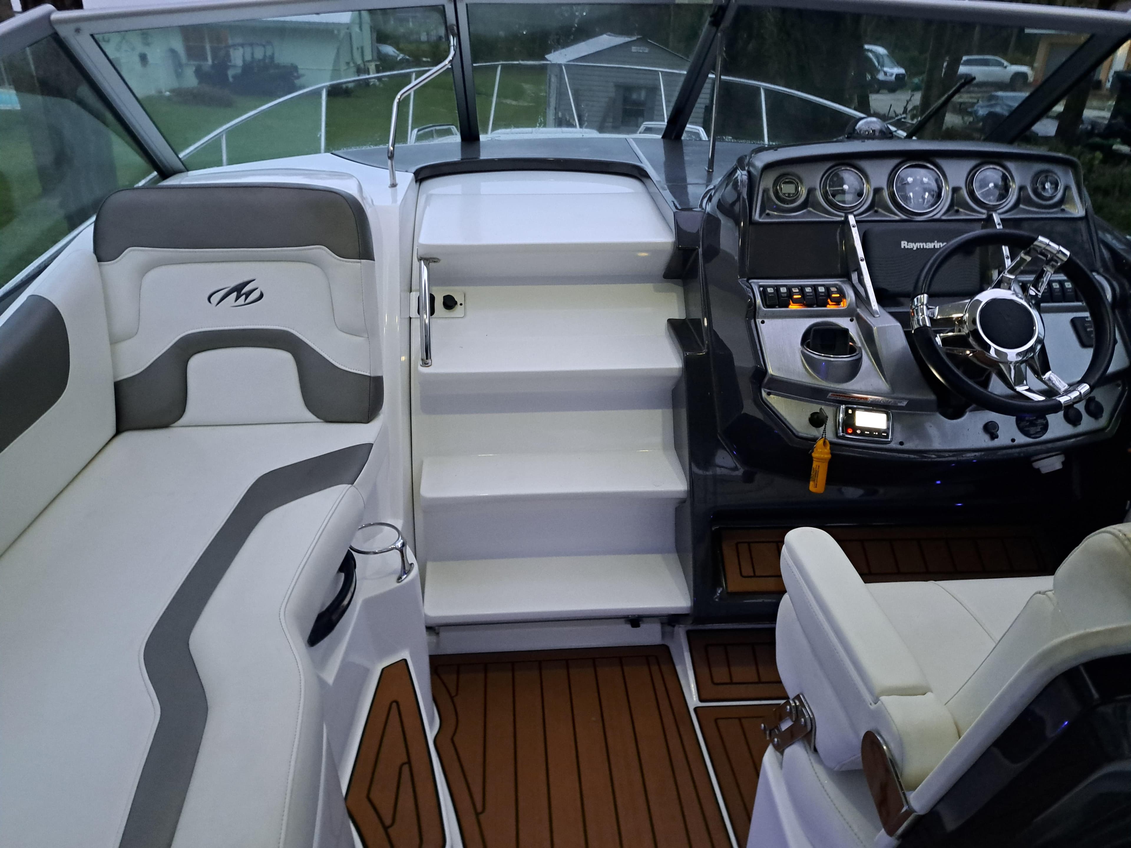 2015 Monterey 295 Sport Yacht cockpit with modern dashboard and seating.