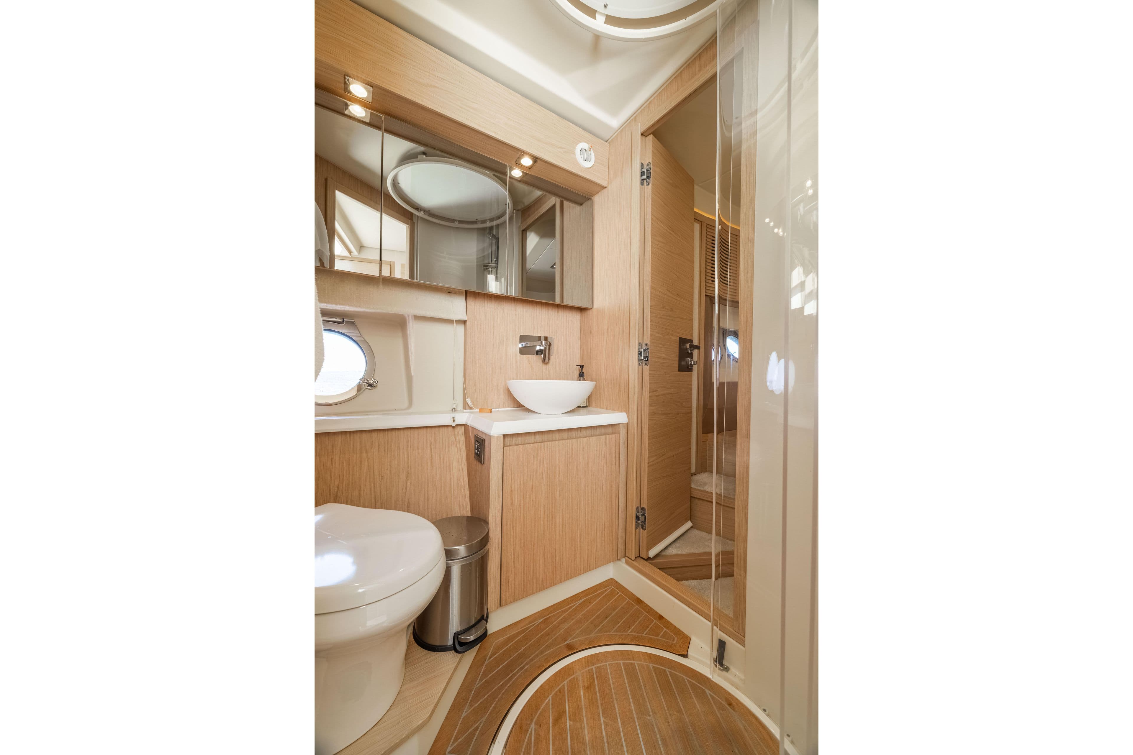 Luxurious bathroom interior of 2017 Monte Carlo Yachts MC5, featuring modern fixtures and wood accents.