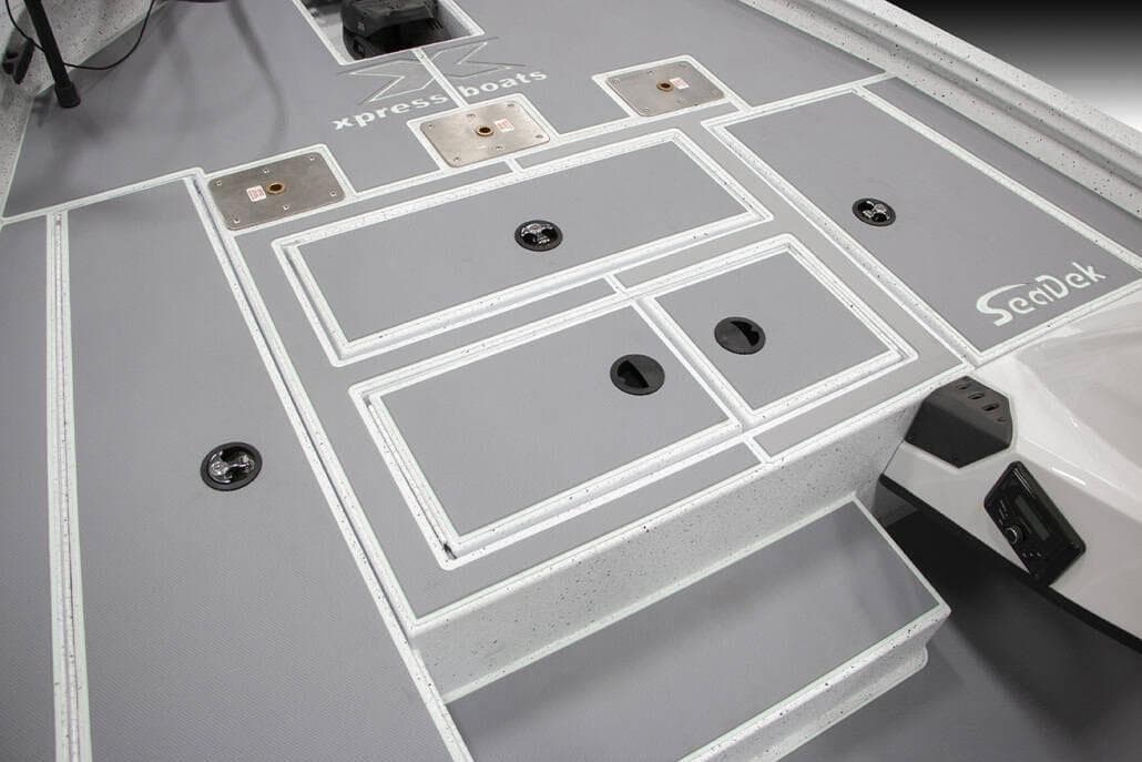 Manufacturer Provided Image: 2026 Xpress H18C Crappie boat deck with SeaDek flooring and storage compartments.