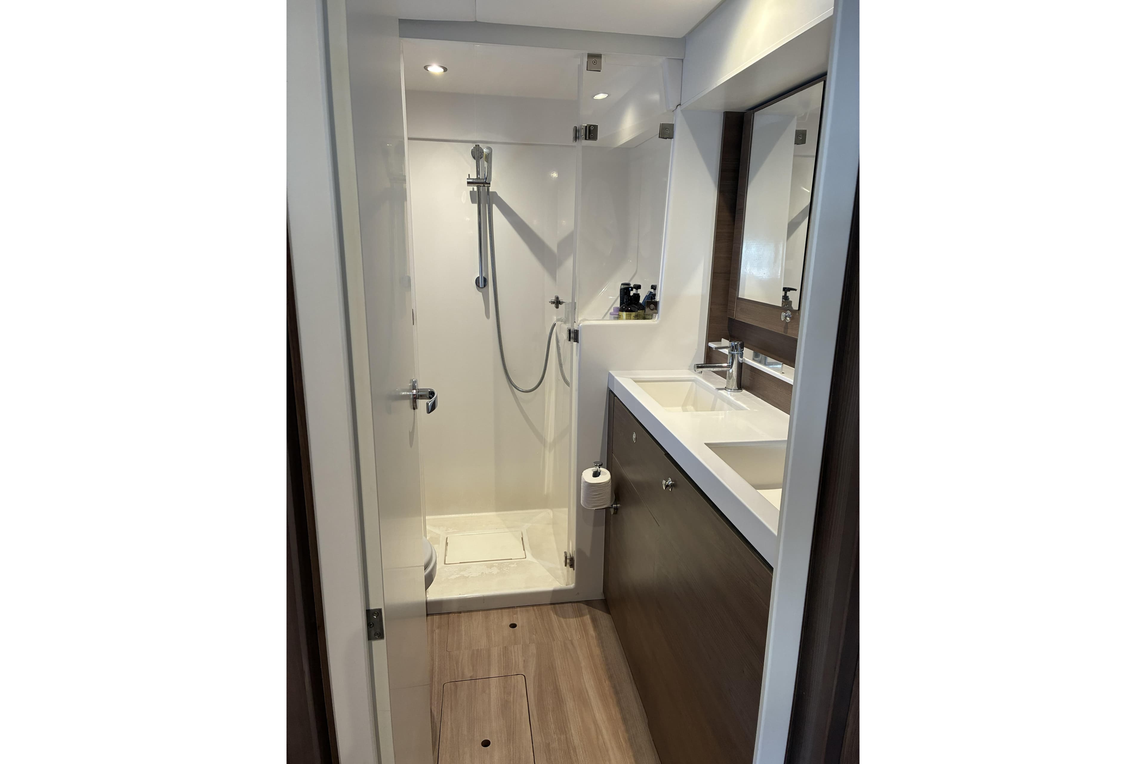 Modern bathroom in 2023 Bali 4.2 yacht with shower and sink.