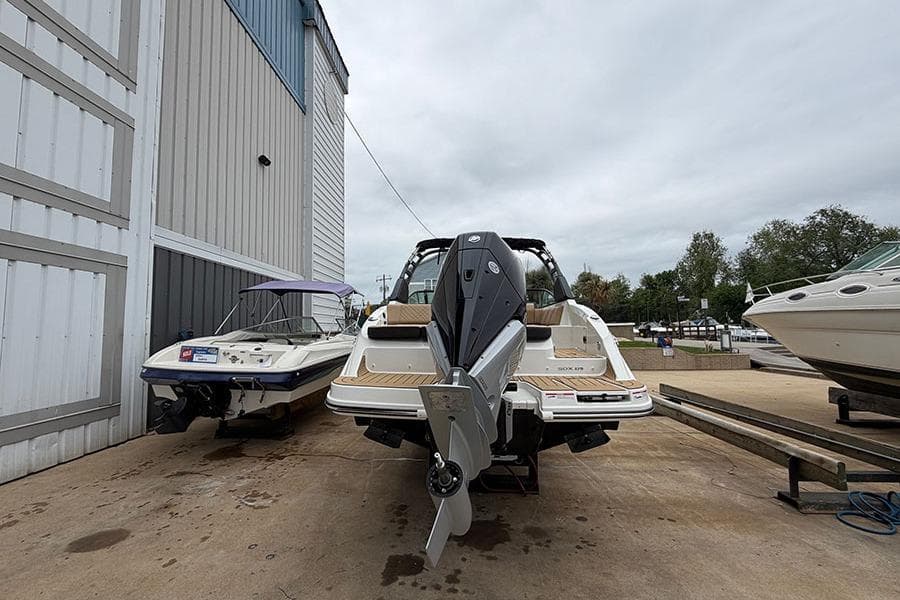 2026 Sea Ray SDX 270 Outboard boat parked at a marina, rear view.