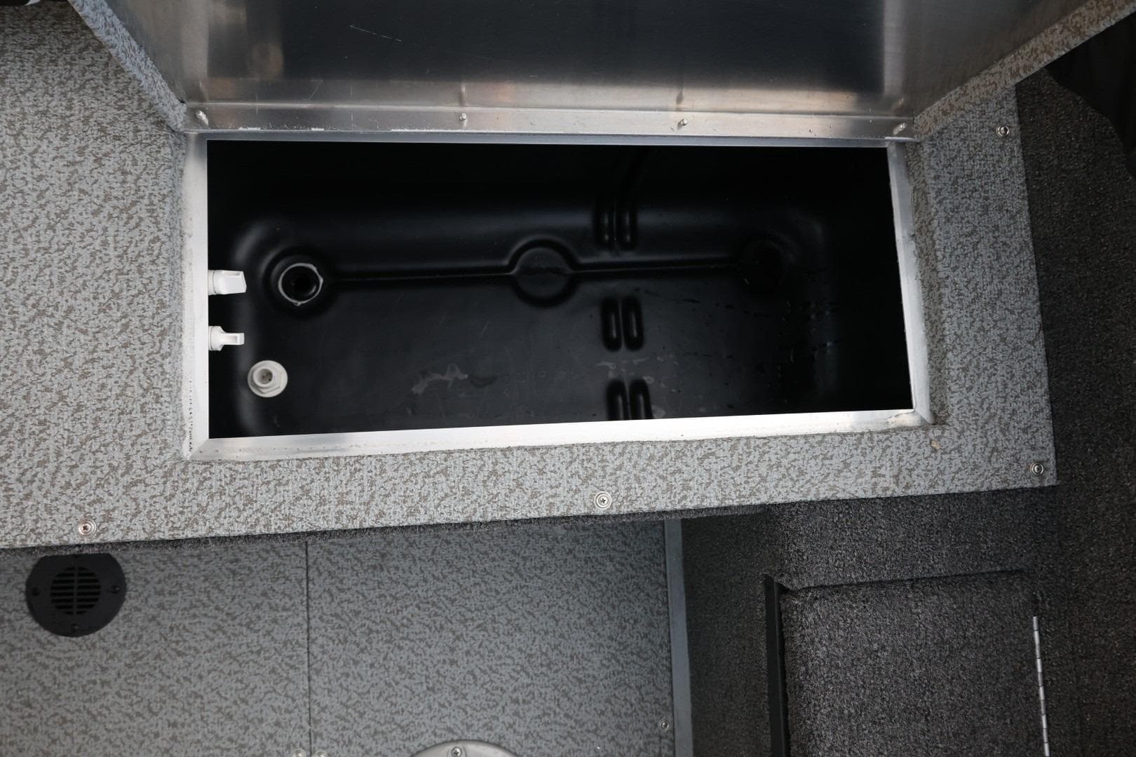 2026 Lowe Fishing Machine 1675 WT livewell compartment, featuring durable interior design.